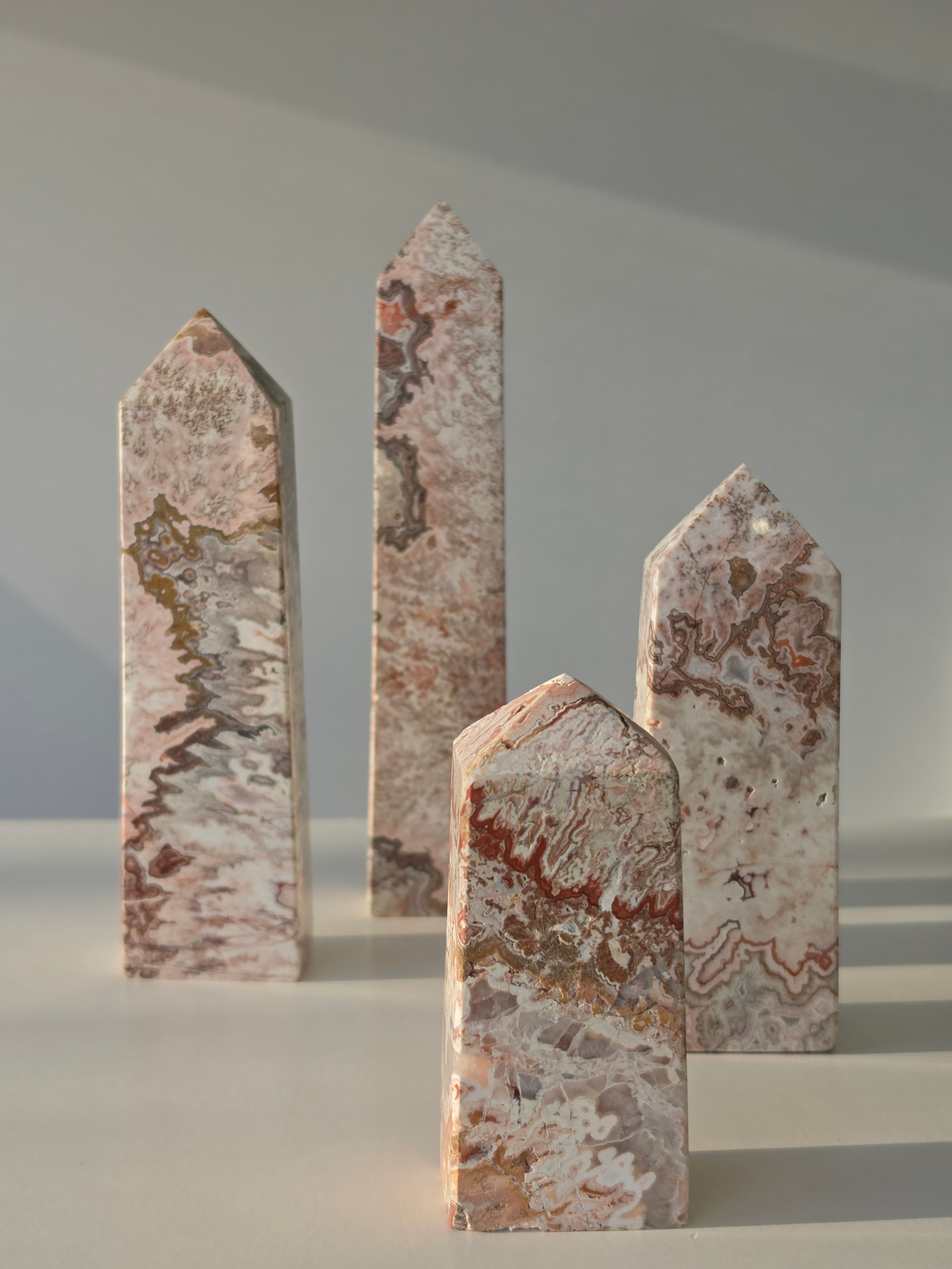 High quality Pink Mexican Lace Agate crystal tower with soft rose tones, natural lace patterns, and elegant statement décor styling by Stone and Bloom