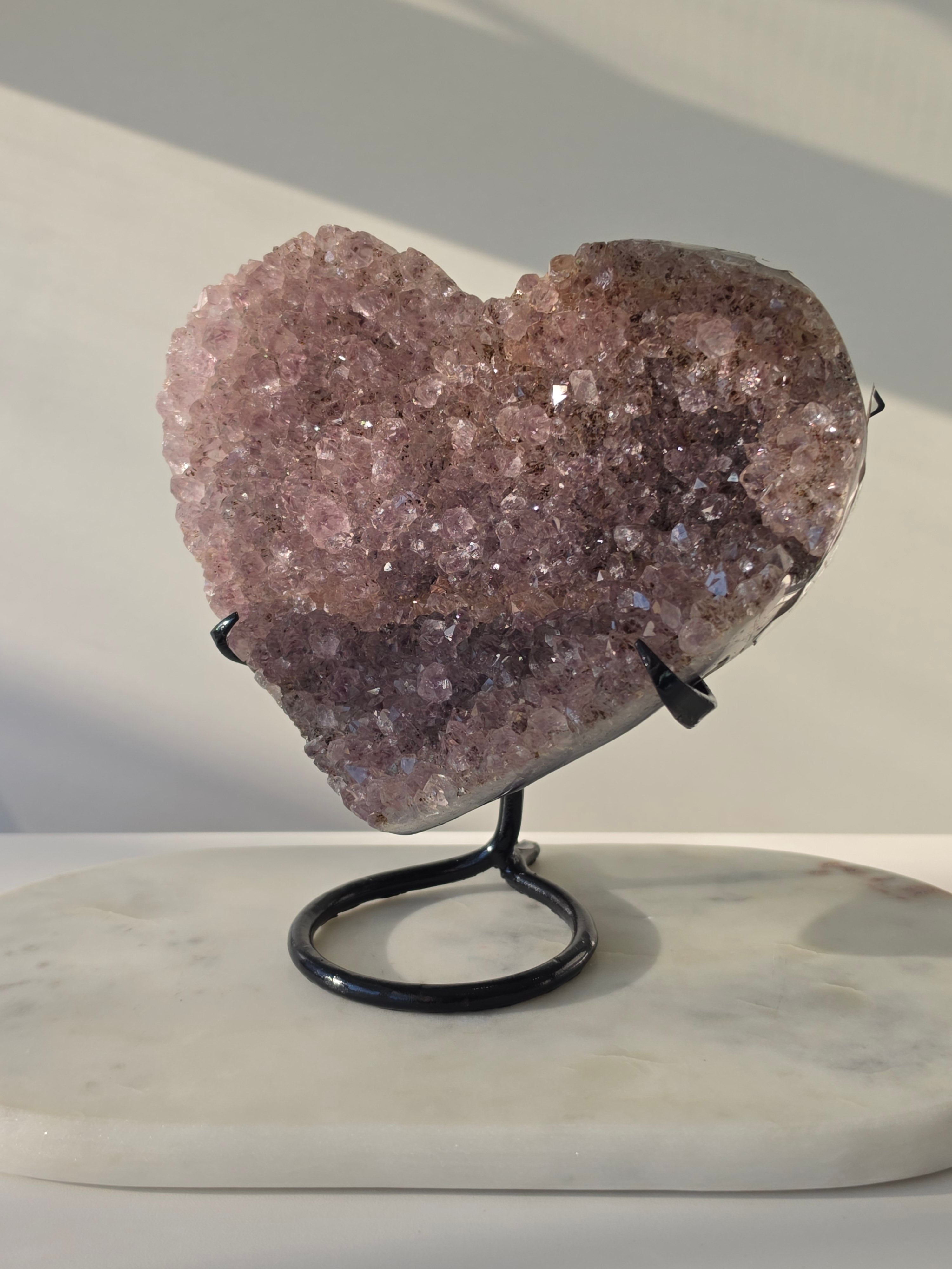 Premium natural Brazilian Amethyst crystal featuring rich violet tones and sparkling quartz formations, hand-selected by Stone & Bloom.