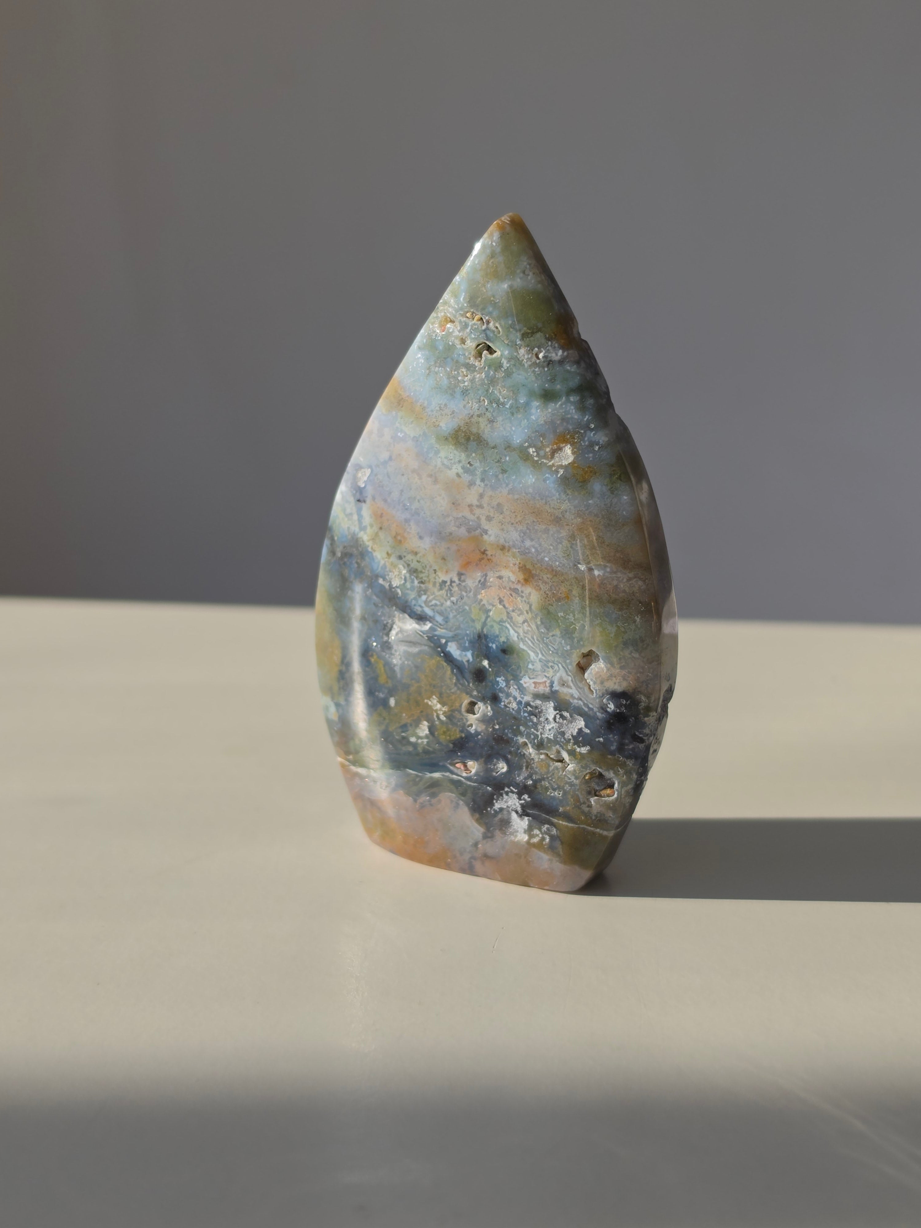 Ocean Jasper, Oceanic tones, our Ocean Jasper Flames, earthy greens, sandy creams, warm peach hues, and dreamy natural patterns, Natural Stone, Crystal Flame, Ocean Jasper Crystal, On trend, Crystal Home Decor, Home Styling