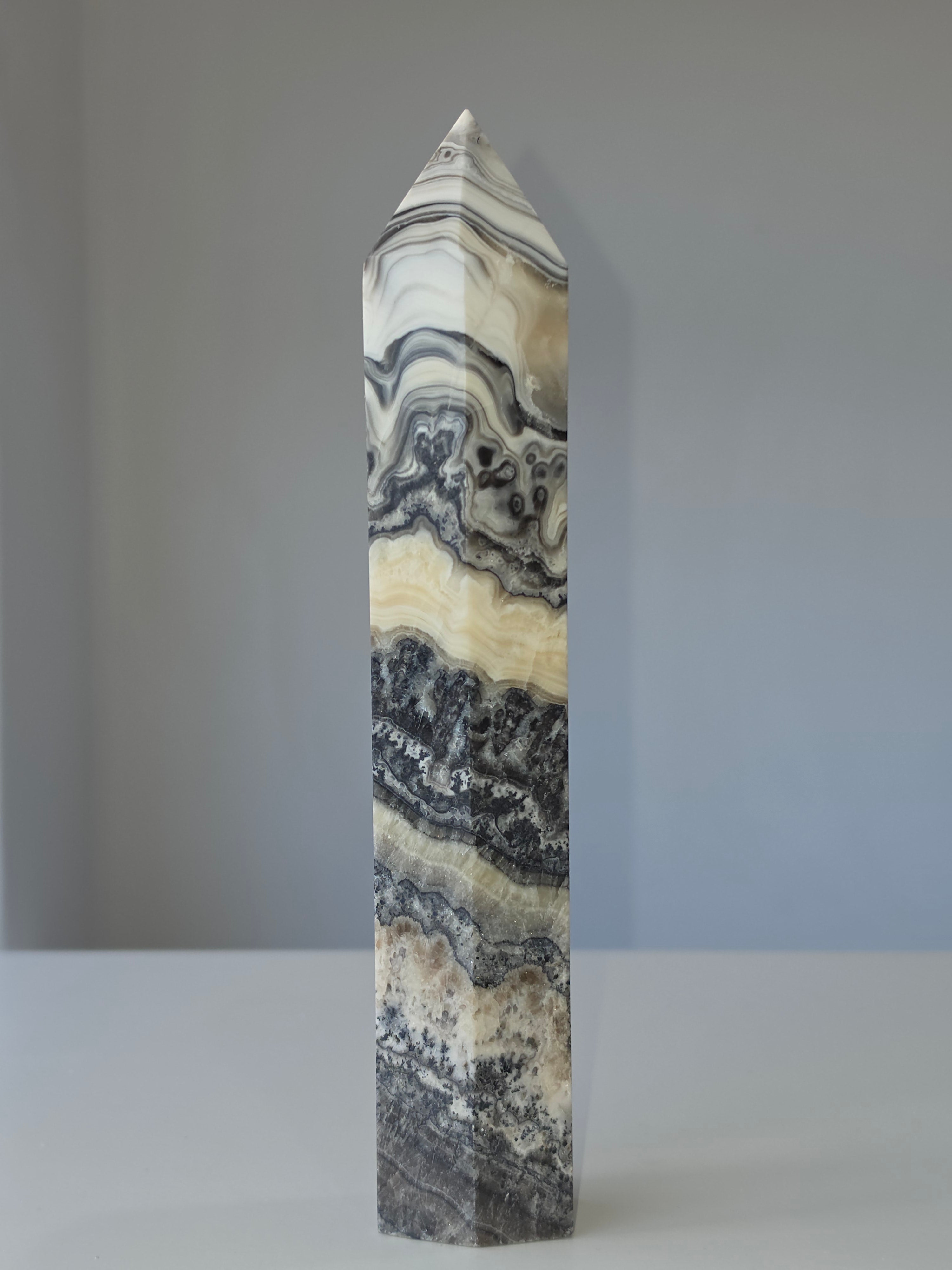 Luxury Chocolate Calcite Tower by Stone and Bloom featuring rich caramel and cream natural banding, Chocolate Calcite Tower, Crystal Tower, Luxury Crystal Décor, Statement Crystal Piece, Stone and Bloom. Home Styling, Natural Stone, On Trend