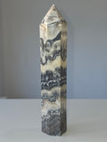 Luxury Chocolate Calcite Tower by Stone and Bloom featuring rich caramel and cream natural banding, Chocolate Calcite Tower, Crystal Tower, Luxury Crystal Décor, Statement Crystal Piece, Stone and Bloom. Home Styling, Natural Stone, On Trend