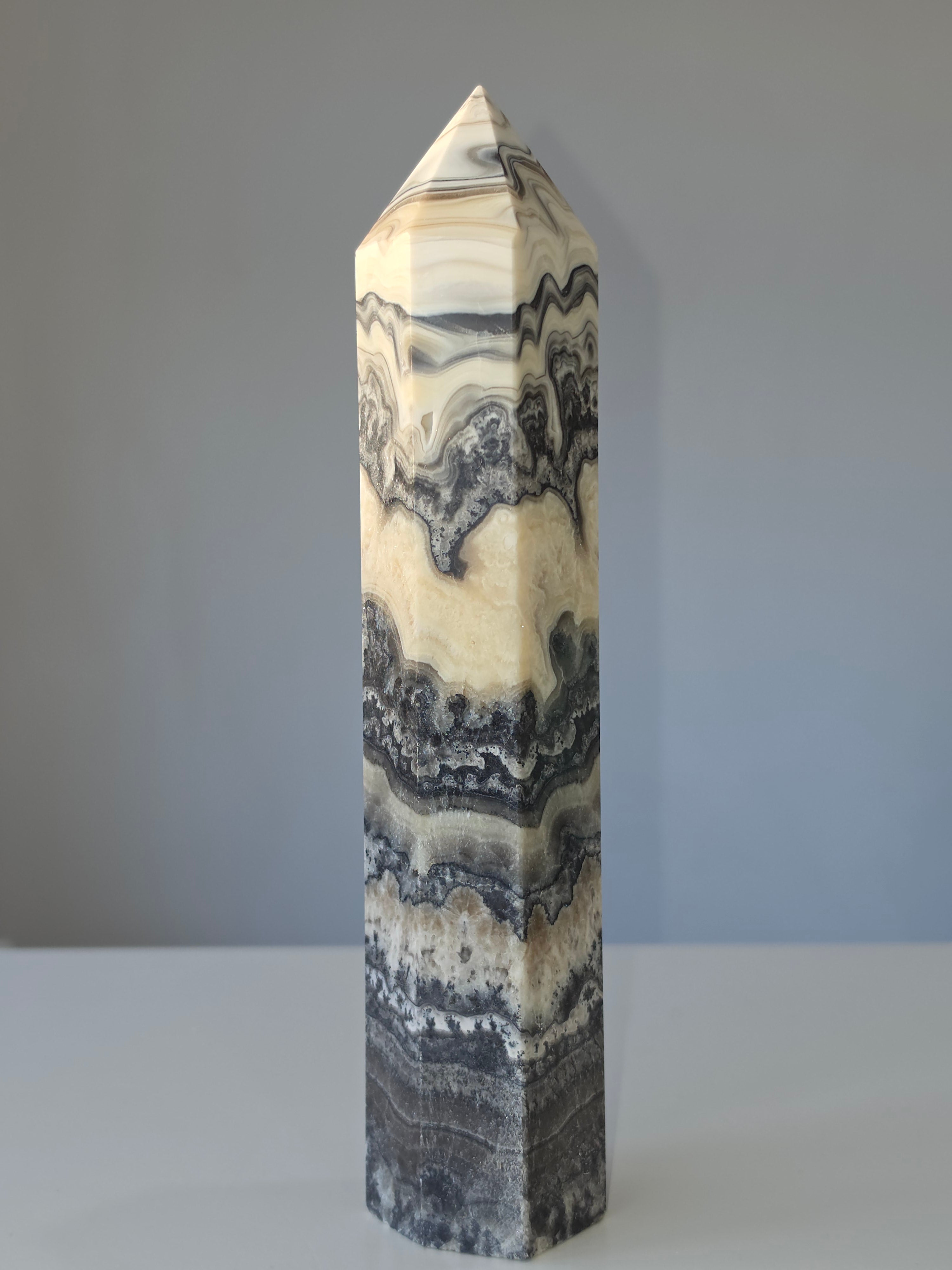 Luxury Chocolate Calcite Tower by Stone and Bloom featuring rich caramel and cream natural banding, Chocolate Calcite Tower, Crystal Tower, Luxury Crystal Décor, Statement Crystal Piece, Stone and Bloom. Home Styling, Natural Stone, On Trend