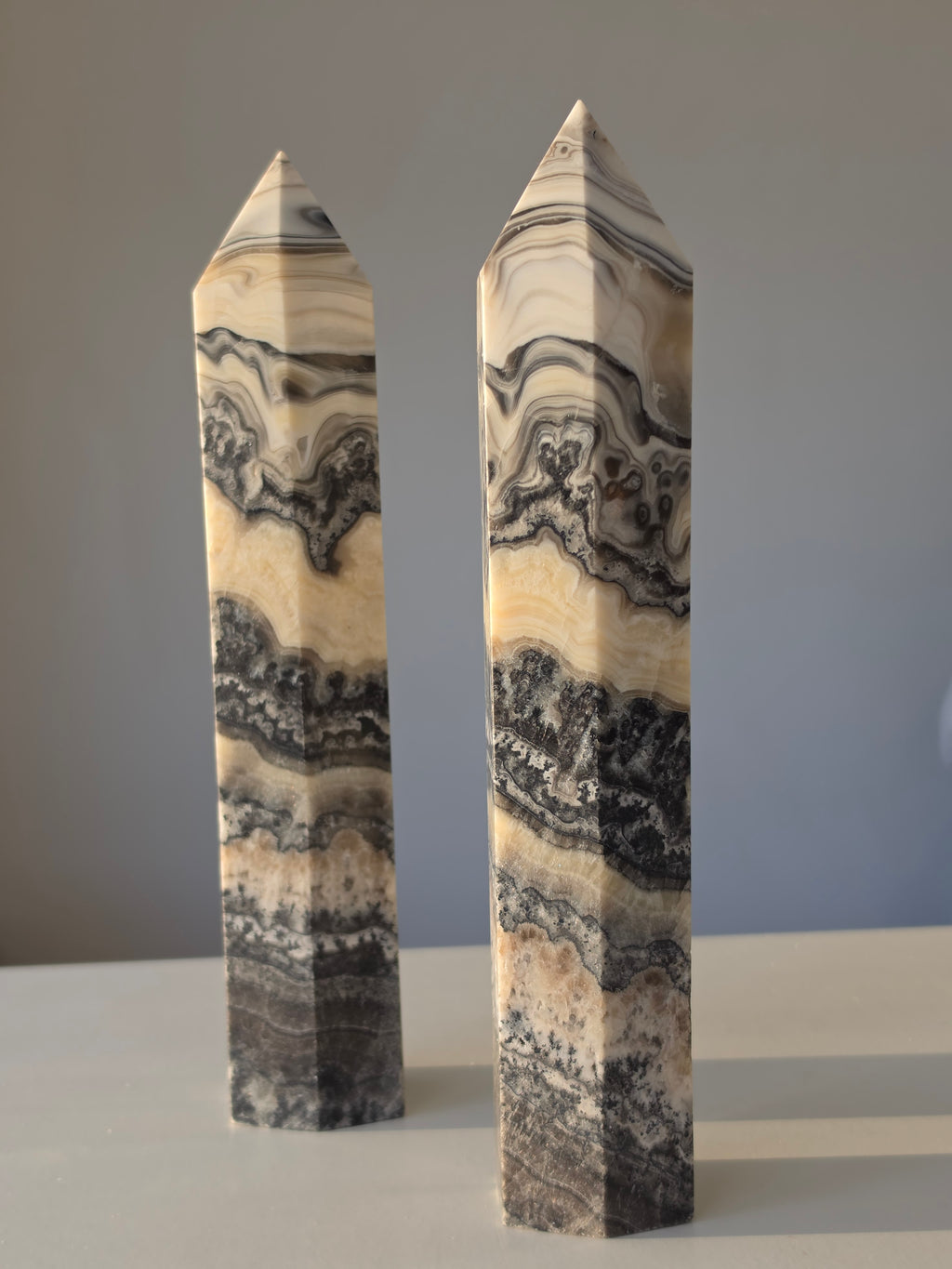 Luxury Chocolate Calcite Tower by Stone and Bloom featuring rich caramel and cream natural banding, Chocolate Calcite Tower, Crystal Tower, Luxury Crystal Décor, Statement Crystal Piece, Stone and Bloom. Home Styling, Natural Stone, On Trend