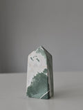 High quality Ocean Jasper crystal tower with calming sage green hues, intricate natural patterns, and elegant statement décor styling by Stone and Bloom.