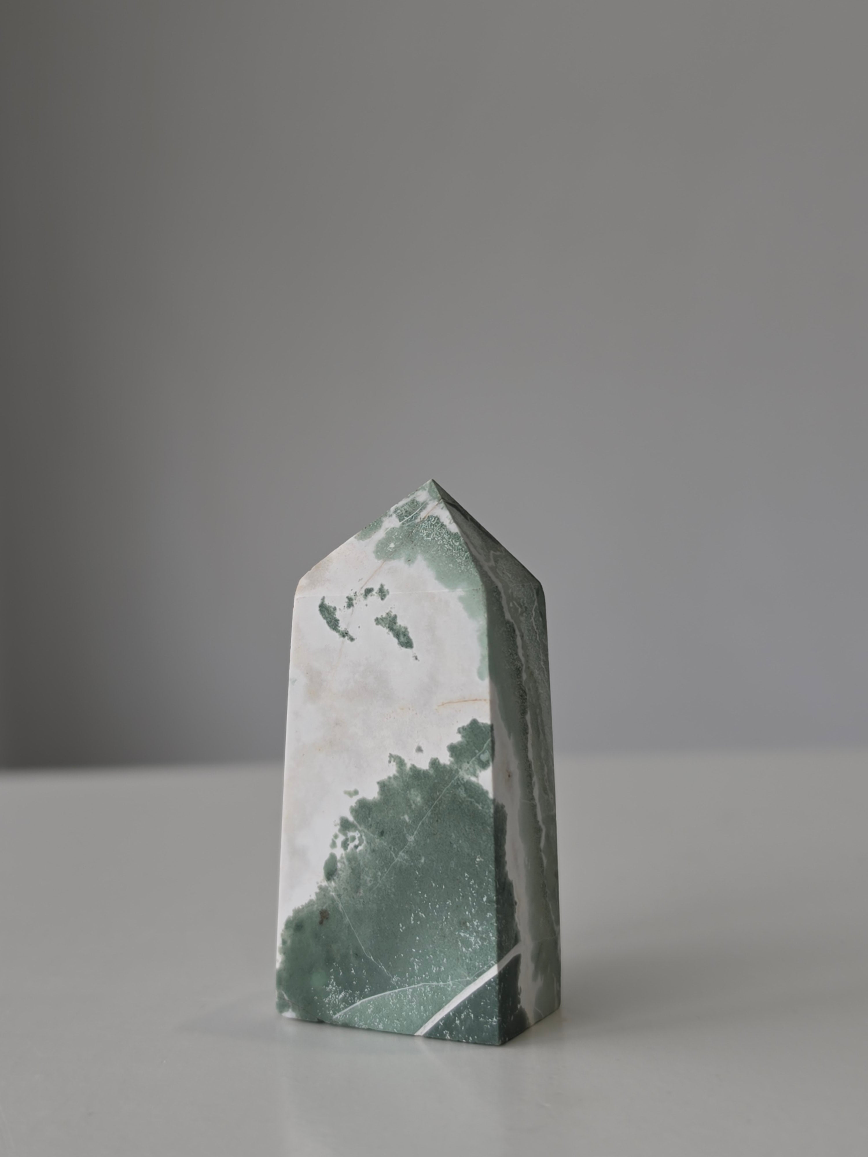 High quality Ocean Jasper crystal tower with calming sage green hues, intricate natural patterns, and elegant statement décor styling by Stone and Bloom.