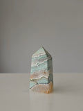 High quality Ocean Jasper crystal tower with calming sage green hues, intricate natural patterns, and elegant statement décor styling by Stone and Bloom.