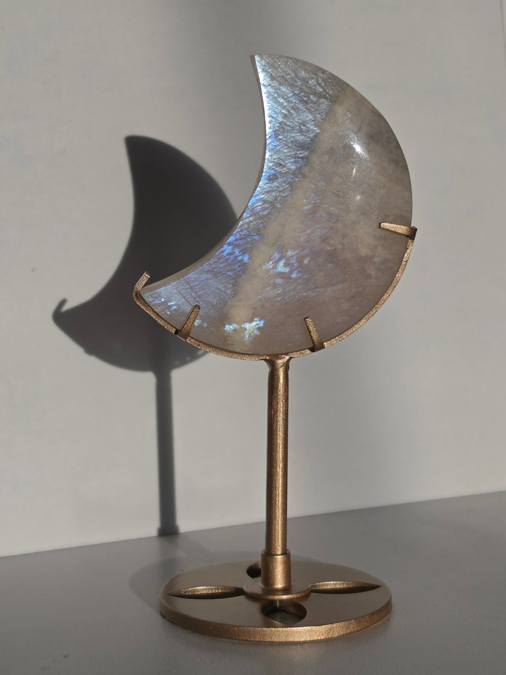 Luxury Moonstone Moon on Stand by Stone and Bloom featuring luminous pearlescent flashes and celestial beauty