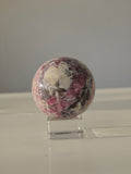 Luxury Pink Tourmaline Sphere by Stone and Bloom featuring rich raspberry and blush tones with intricate natural mineral formations