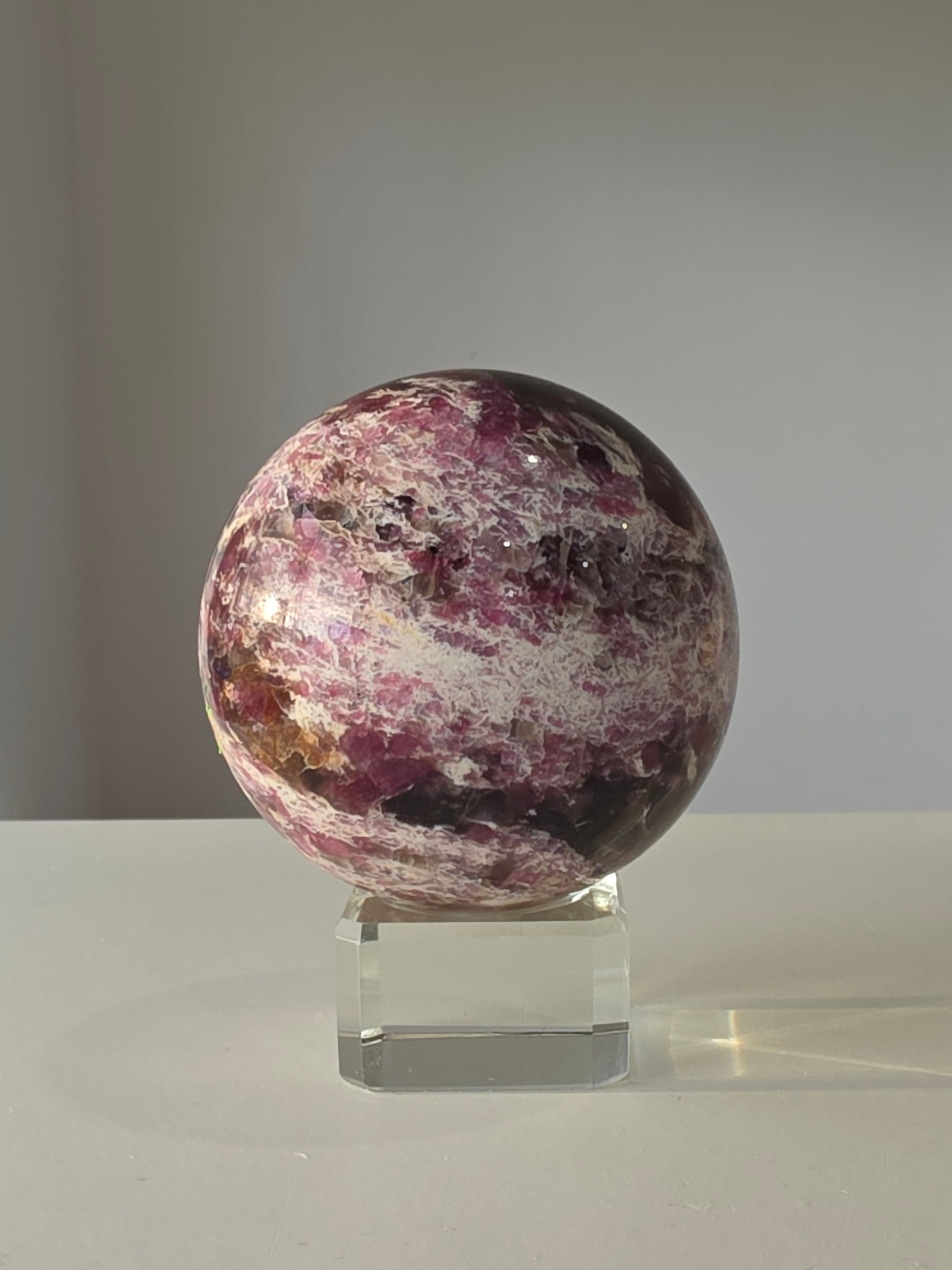 Luxury Pink Tourmaline Sphere by Stone and Bloom featuring rich raspberry and blush tones with intricate natural mineral formations
