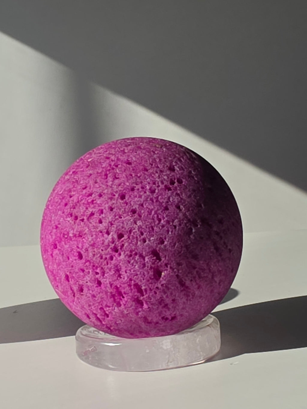 Luxury Natural Ruby Sphere by Stone and Bloom featuring rich raspberry and crimson tones, unique natural mineral formations, and exceptional statement décor appeal.