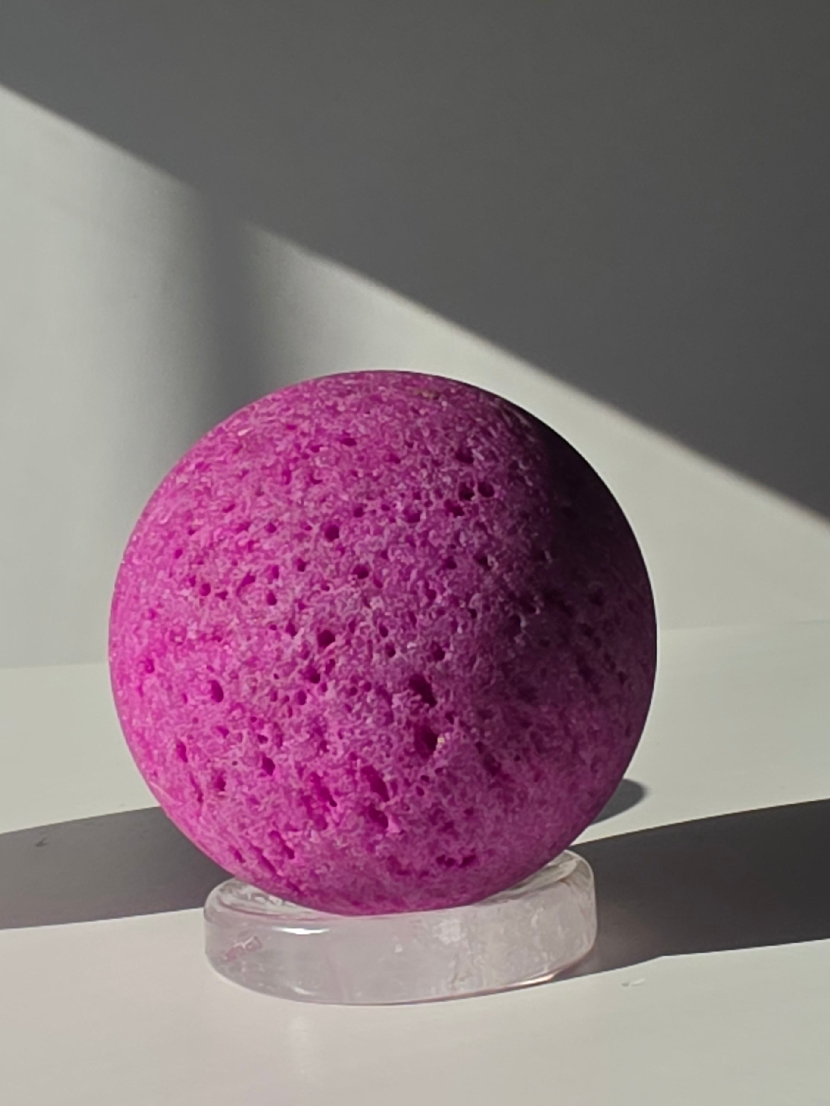 Luxury Natural Ruby Sphere by Stone and Bloom featuring rich raspberry and crimson tones, unique natural mineral formations, and exceptional statement décor appeal.