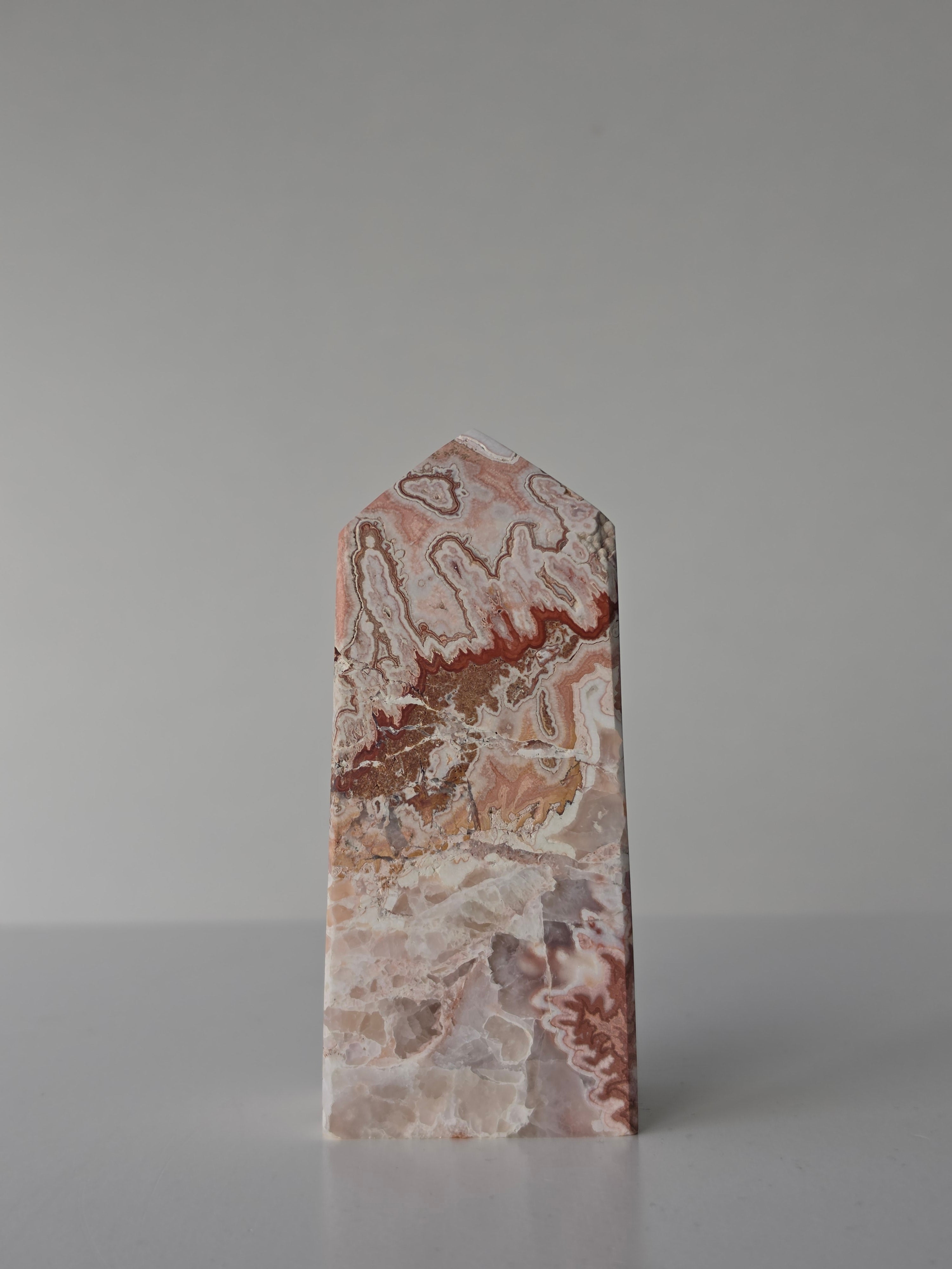 High quality Pink Mexican Lace Agate crystal tower with soft rose tones, natural lace patterns, and elegant statement décor styling by Stone and Bloom