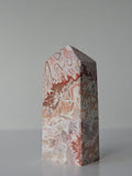 High quality Pink Mexican Lace Agate crystal tower with soft rose tones, natural lace patterns, and elegant statement décor styling by Stone and Bloom