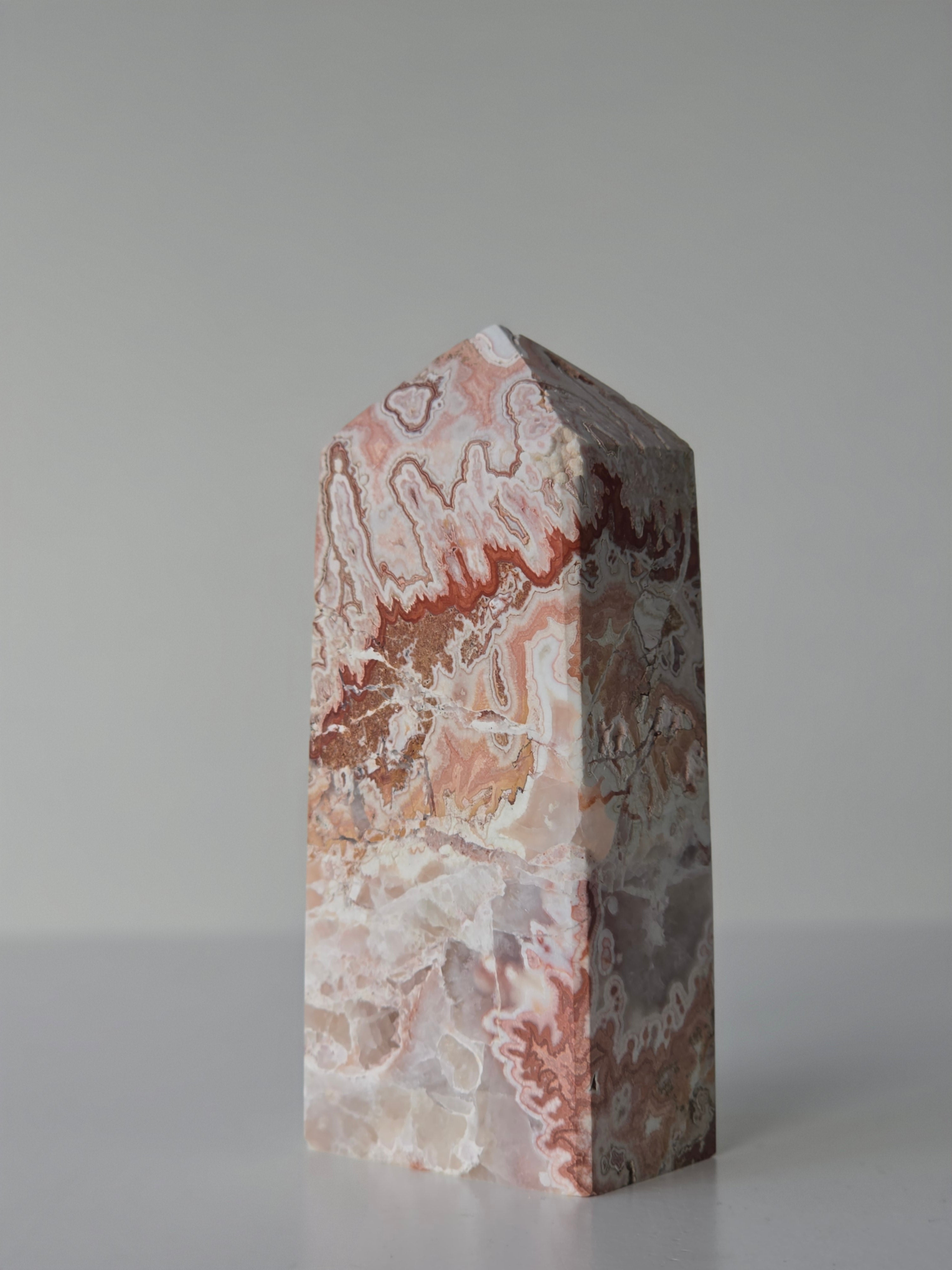 High quality Pink Mexican Lace Agate crystal tower with soft rose tones, natural lace patterns, and elegant statement décor styling by Stone and Bloom