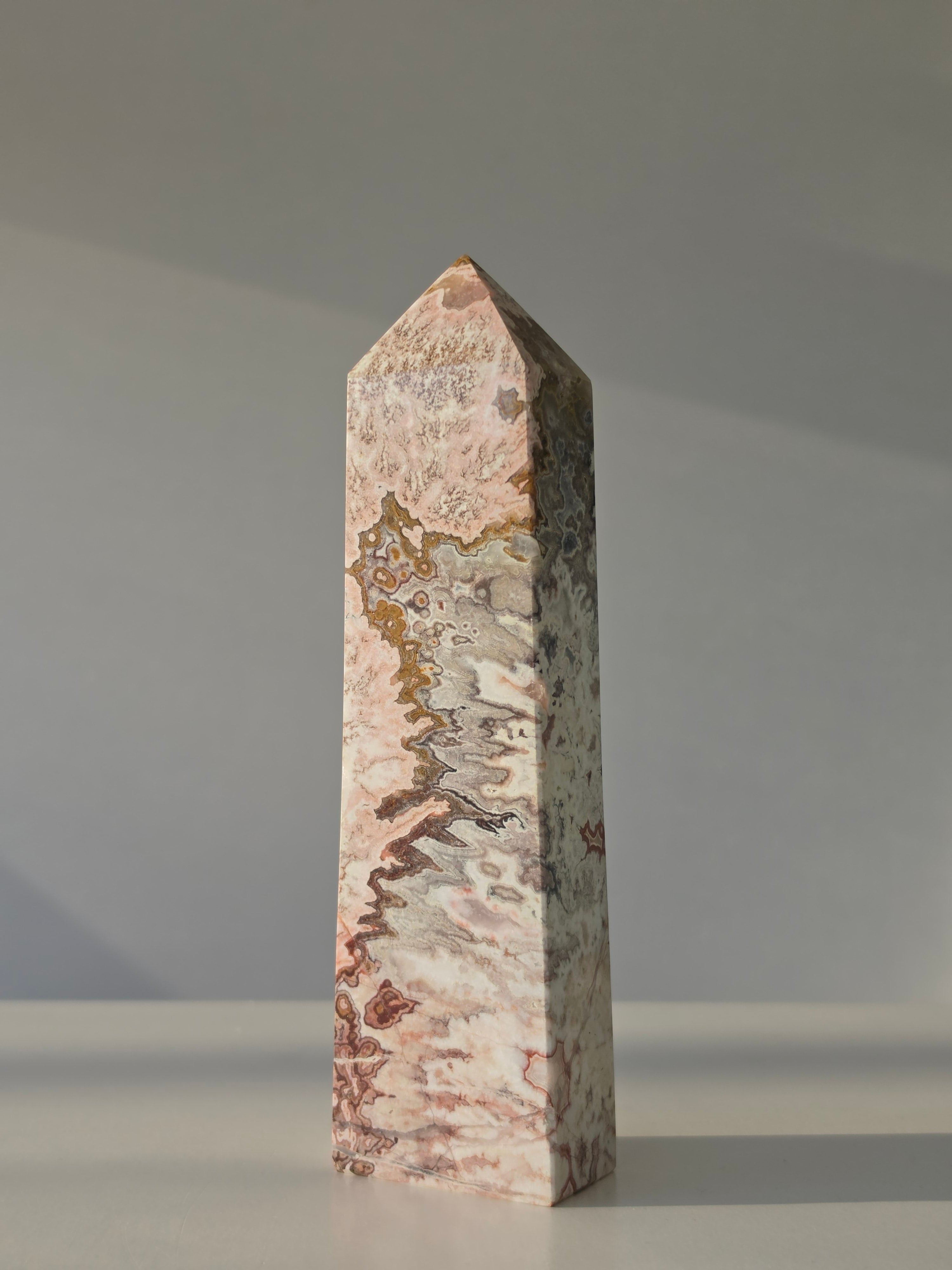 High quality Pink Mexican Lace Agate crystal tower with soft rose tones, natural lace patterns, and elegant statement décor styling by Stone and Bloom