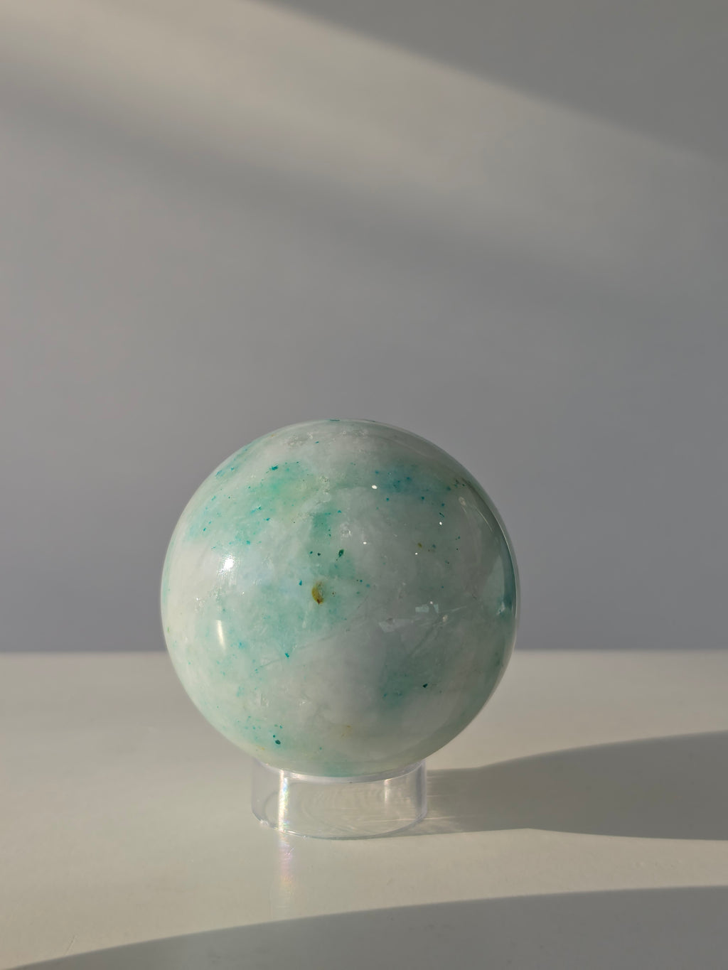 Luxury Phoenix Stone Tower by Stone and Bloom featuring vibrant turquoise, sage green, and earthy natural formations