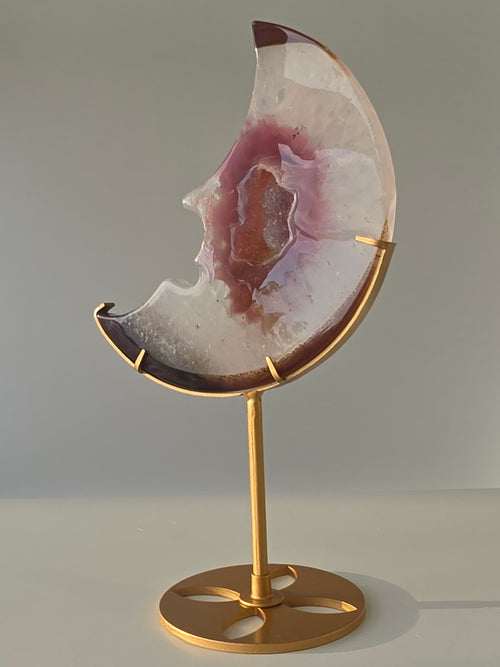 Luxury Agate Druzy Moon on gold stand featuring soft ivory and mauve banding, sparkling crystal centre, and elegant celestial styling curated by Stone and Bloom