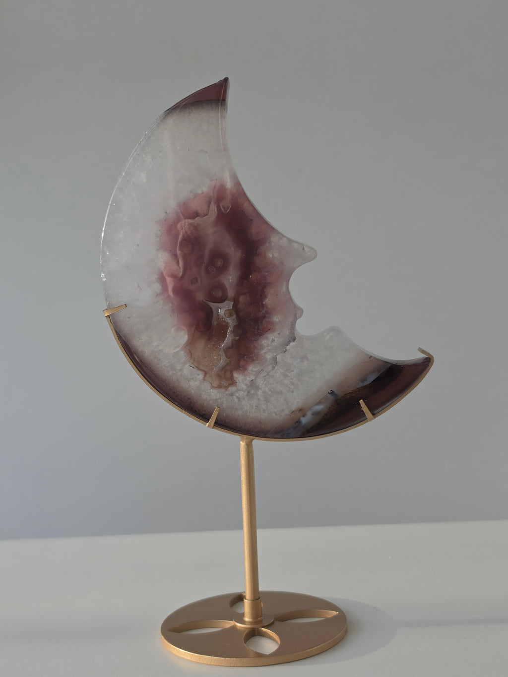 Luxury Agate Druzy Moon on gold stand featuring soft ivory and mauve banding, sparkling crystal centre, and elegant celestial styling curated by Stone and Bloom