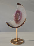 Luxury Pink Agate Druzy Moon on gold stand featuring soft ivory and mauve banding, sparkling crystal centre, and elegant celestial styling curated by Stone and Bloom