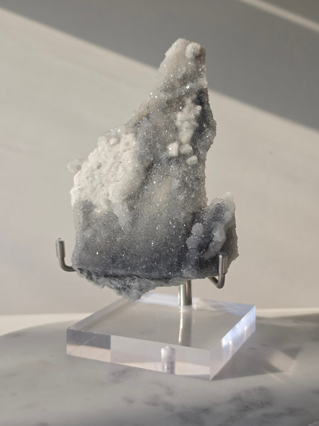 High-grade Sugar Fluorite specimen featuring sparkling silver-grey and white druzy crystals on a display stand, showcasing exceptional crystal coverage and natural sculptural formation