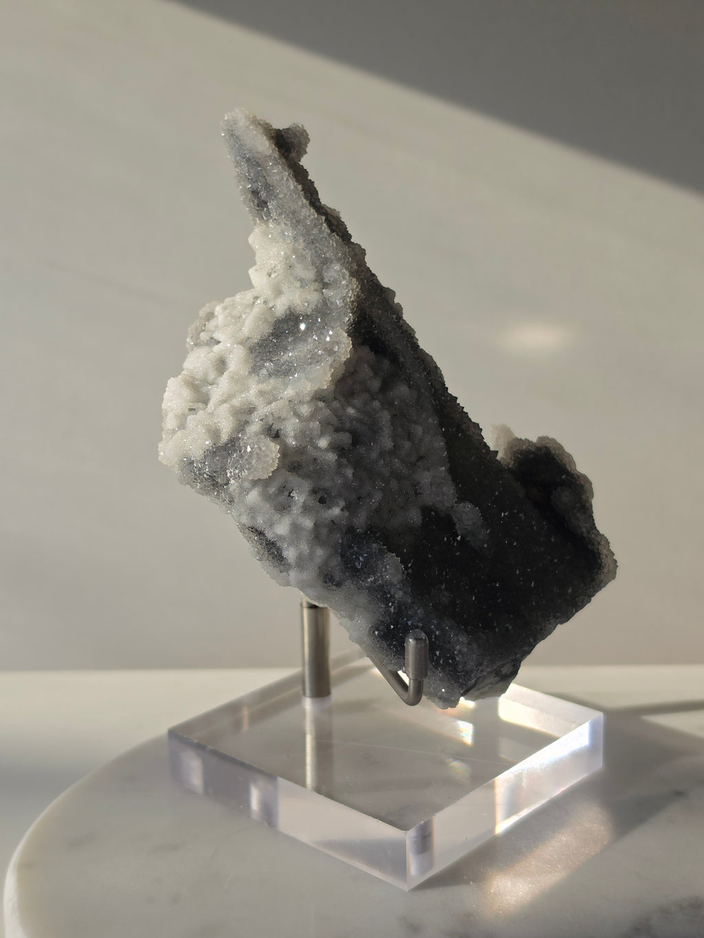 High-grade Sugar Fluorite specimen featuring sparkling silver-grey and white druzy crystals on a display stand, showcasing exceptional crystal coverage and natural sculptural formation
