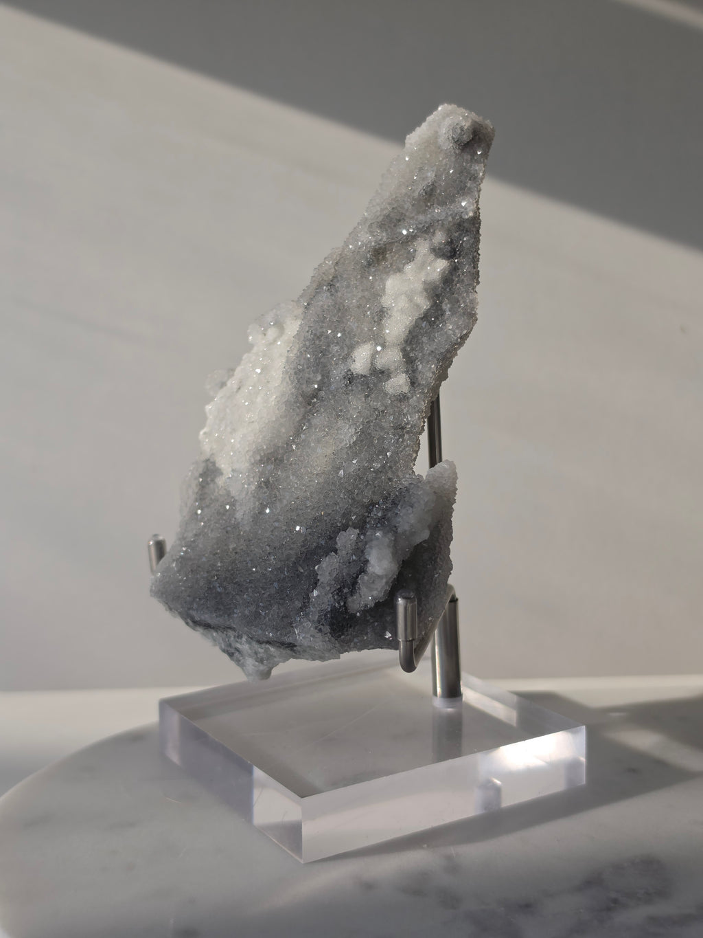 High-grade Sugar Fluorite specimen featuring sparkling silver-grey and white druzy crystals on a display stand, showcasing exceptional crystal coverage and natural sculptural formation