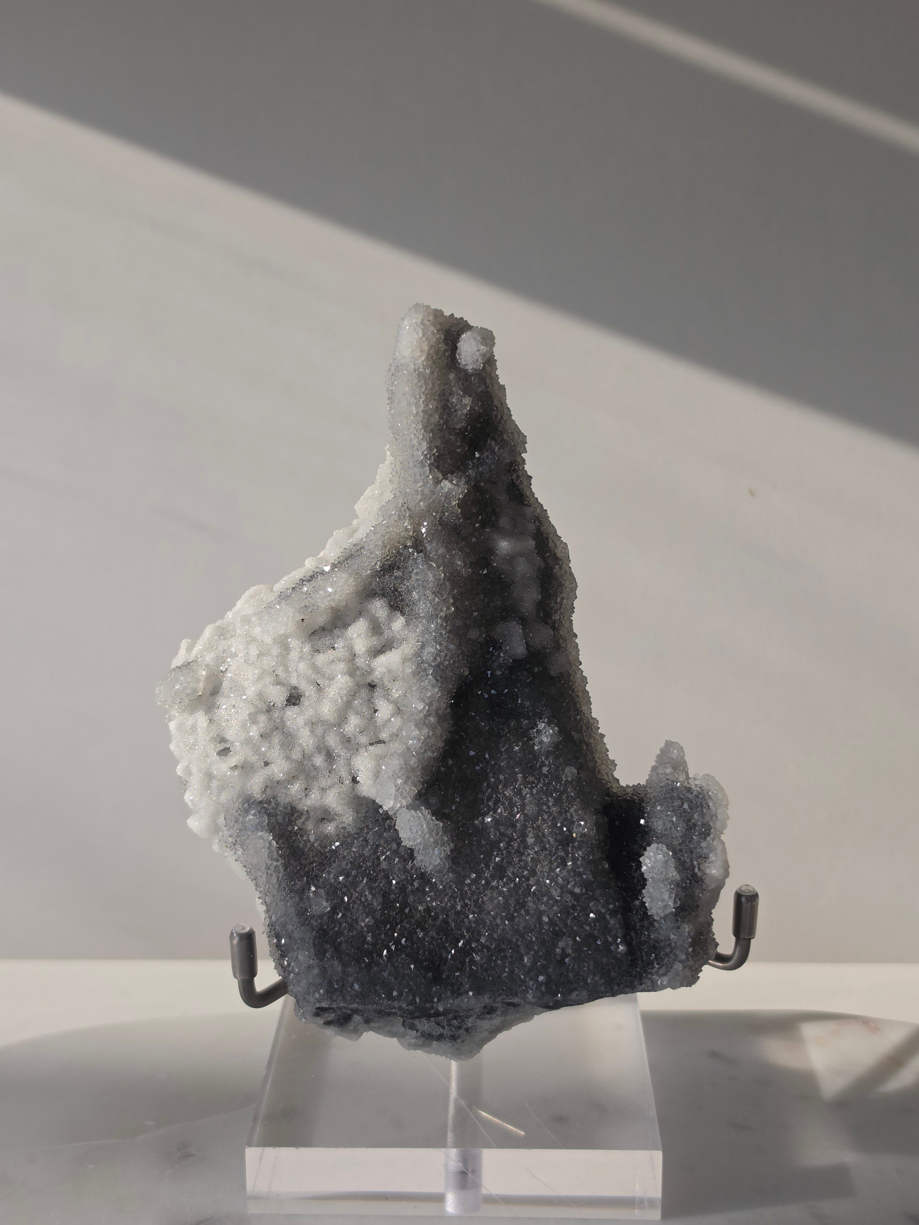 High-grade Sugar Fluorite specimen featuring sparkling silver-grey and white druzy crystals on a display stand, showcasing exceptional crystal coverage and natural sculptural formation