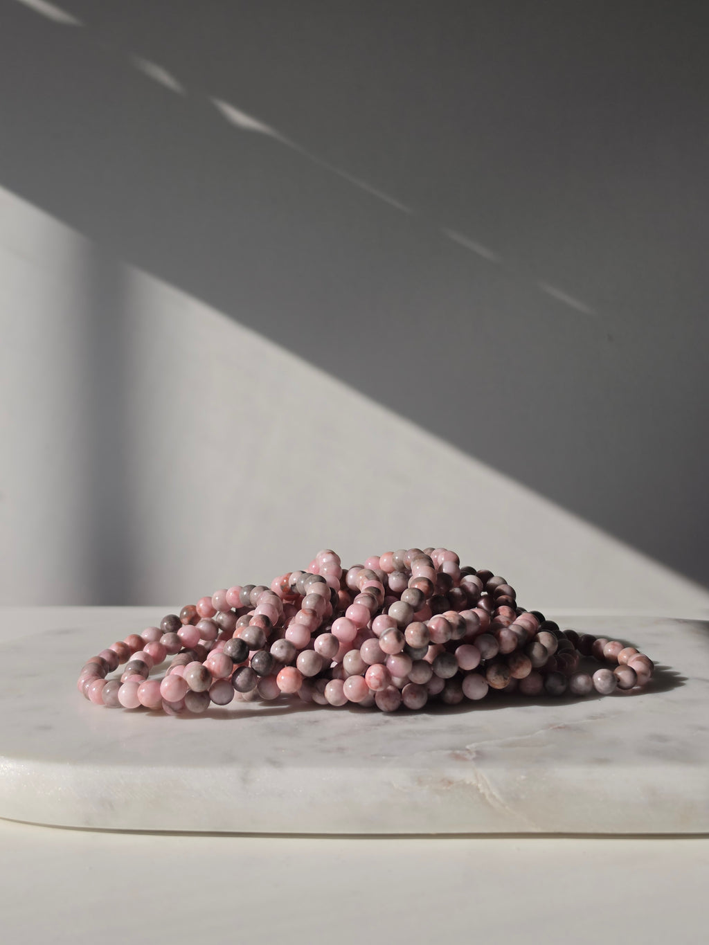 High-grade natural Pink Opal beaded bracelets featuring soft blush pink, dusty rose, mauve, and taupe gemstones with a smooth polished finish, handcrafted with premium quality stones and photographed in natural light.