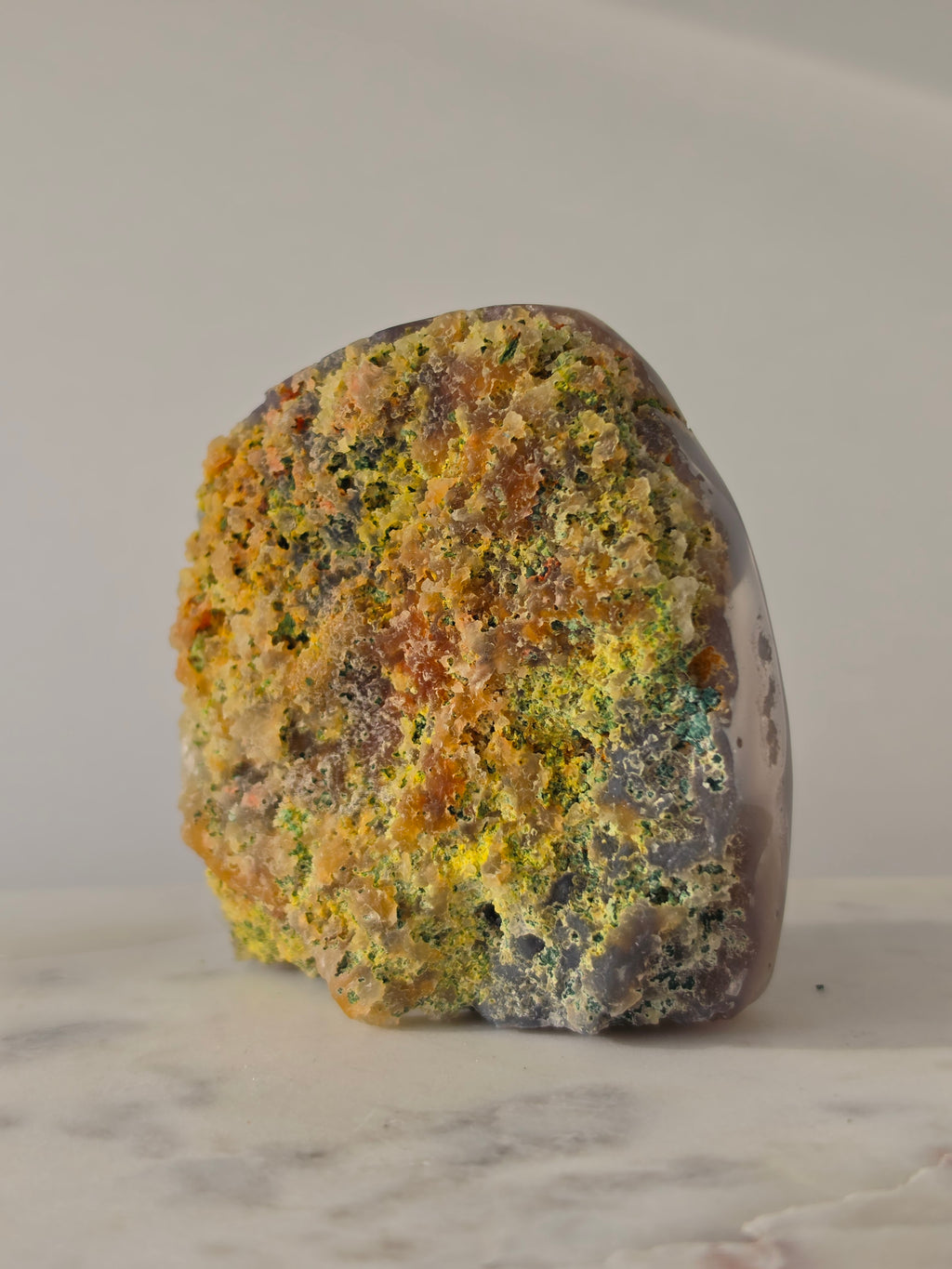 High-grade Brazilian Pink Amethyst cut base featuring a sparkling druzy crystal cavern, soft blush and lavender crystal points, natural agate banding in charcoal and rose tones, polished free-standing edges, and sourced from Rio Grande do Sul, Brazil.