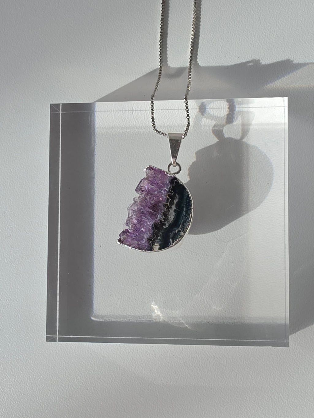 Natural Amethyst Slice Moon Pendant, raw crystal druzy pendant in a silver-plated hypoallergenic setting from the Stone & Bloom Raw Luxe Collection.