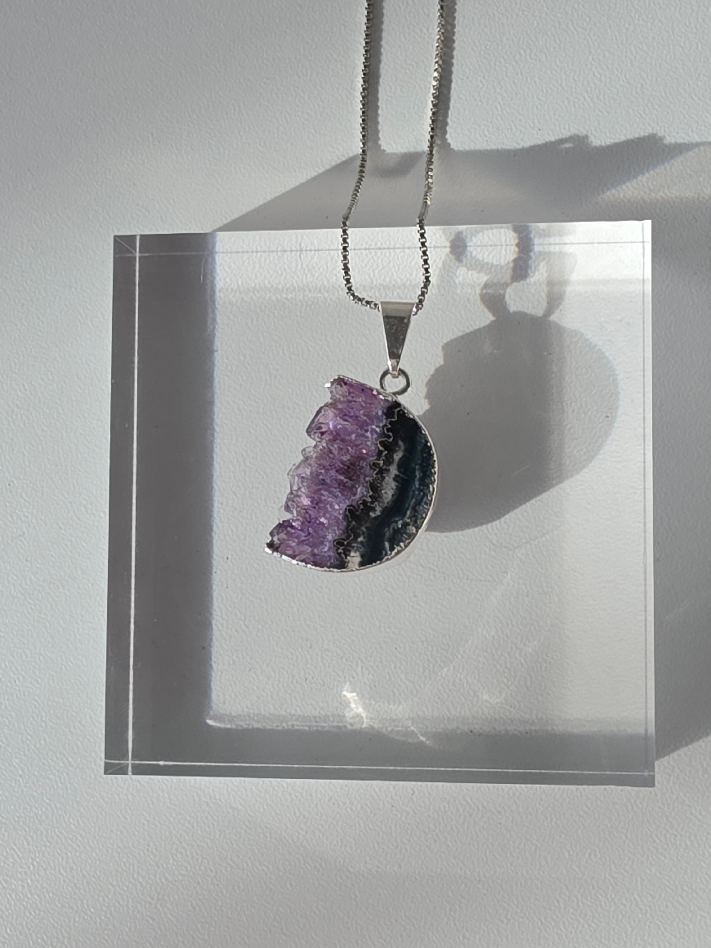 Natural Amethyst Slice Moon Pendant, raw crystal druzy pendant in a silver-plated hypoallergenic setting from the Stone & Bloom Raw Luxe Collection.