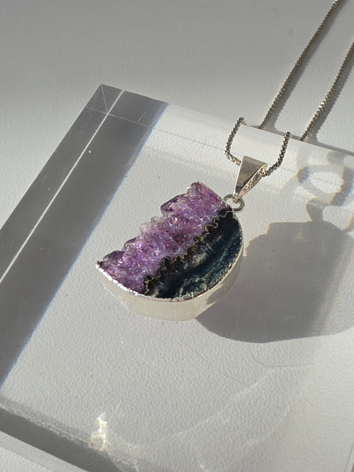 Natural Amethyst Slice Moon Pendant, raw crystal druzy pendant in a silver-plated setting from the Stone & Bloom Raw Luxe Collection.