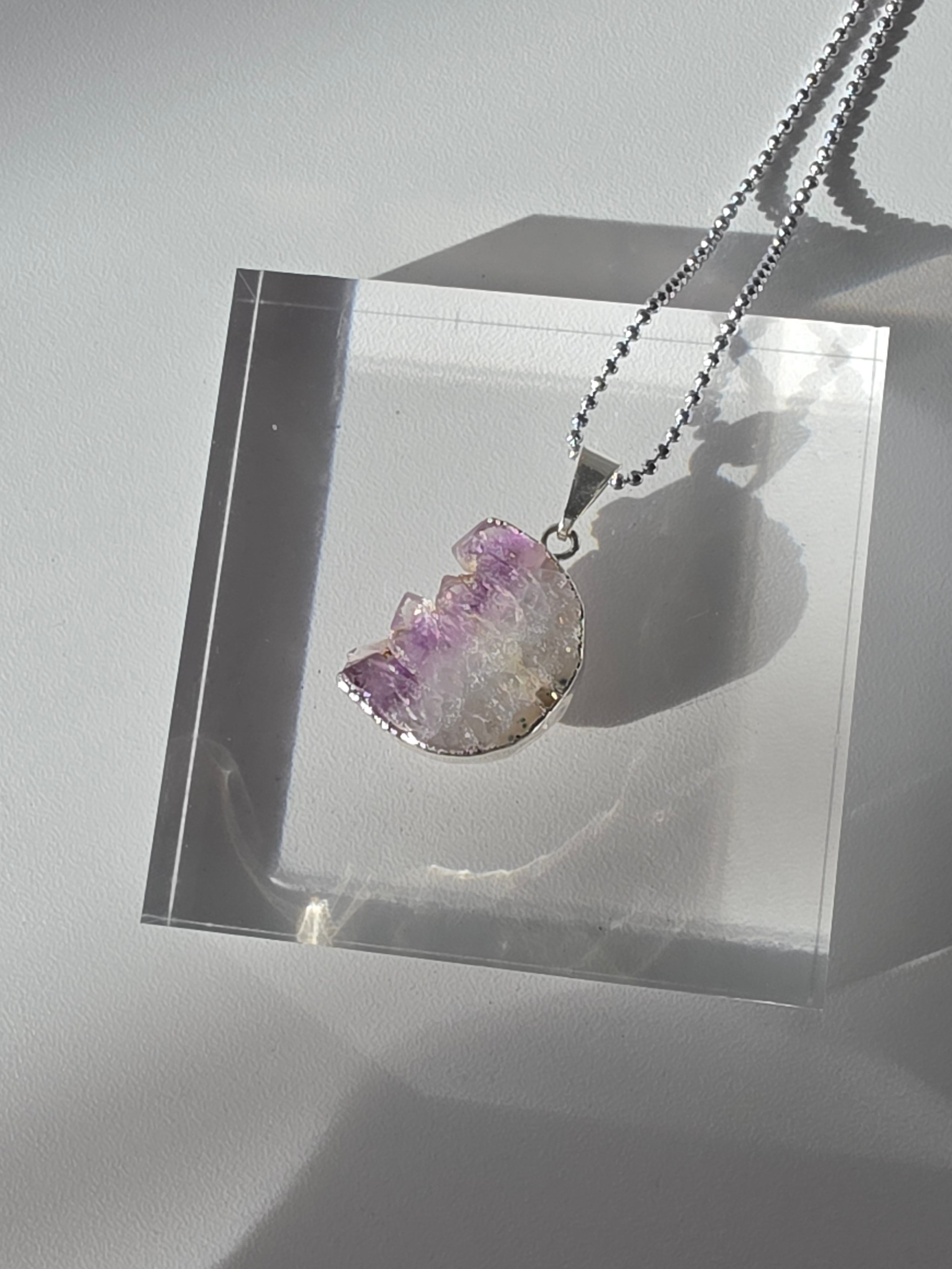 Natural Amethyst Slice Moon Pendant, raw crystal druzy pendant in a silver-plated setting from the Stone & Bloom Raw Luxe Collection.