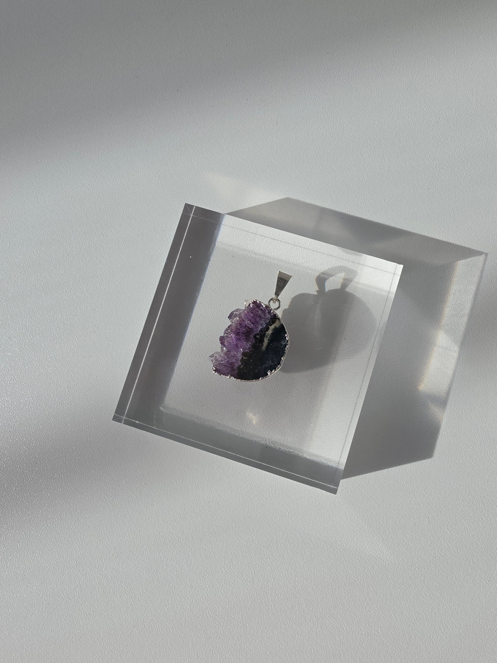 Natural Amethyst Slice Moon Pendant, raw crystal druzy pendant in a silver-plated hypoallergenic setting from the Stone & Bloom Raw Luxe Collection.