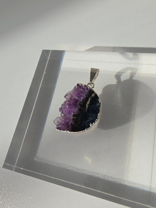 Natural Amethyst Slice Moon Pendant, raw crystal druzy pendant in a silver-plated setting from the Stone & Bloom Raw Luxe Collection.
