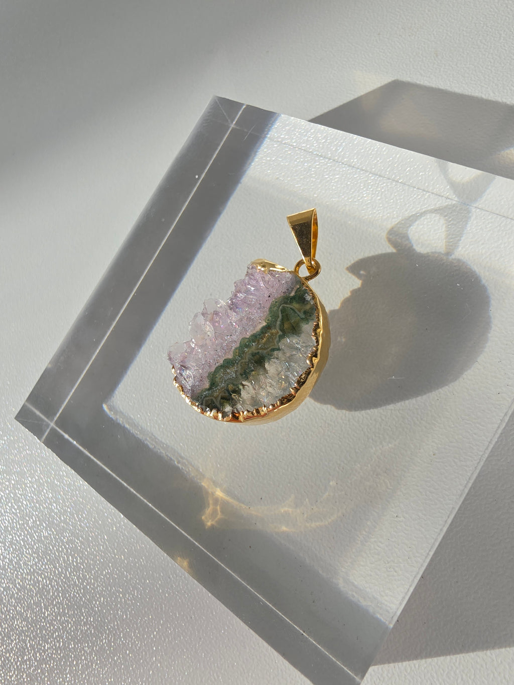 Natural Amethyst Slice Moon Pendant, raw crystal druzy pendant in a gold-plated setting from the Stone & Bloom Raw Luxe Collection.