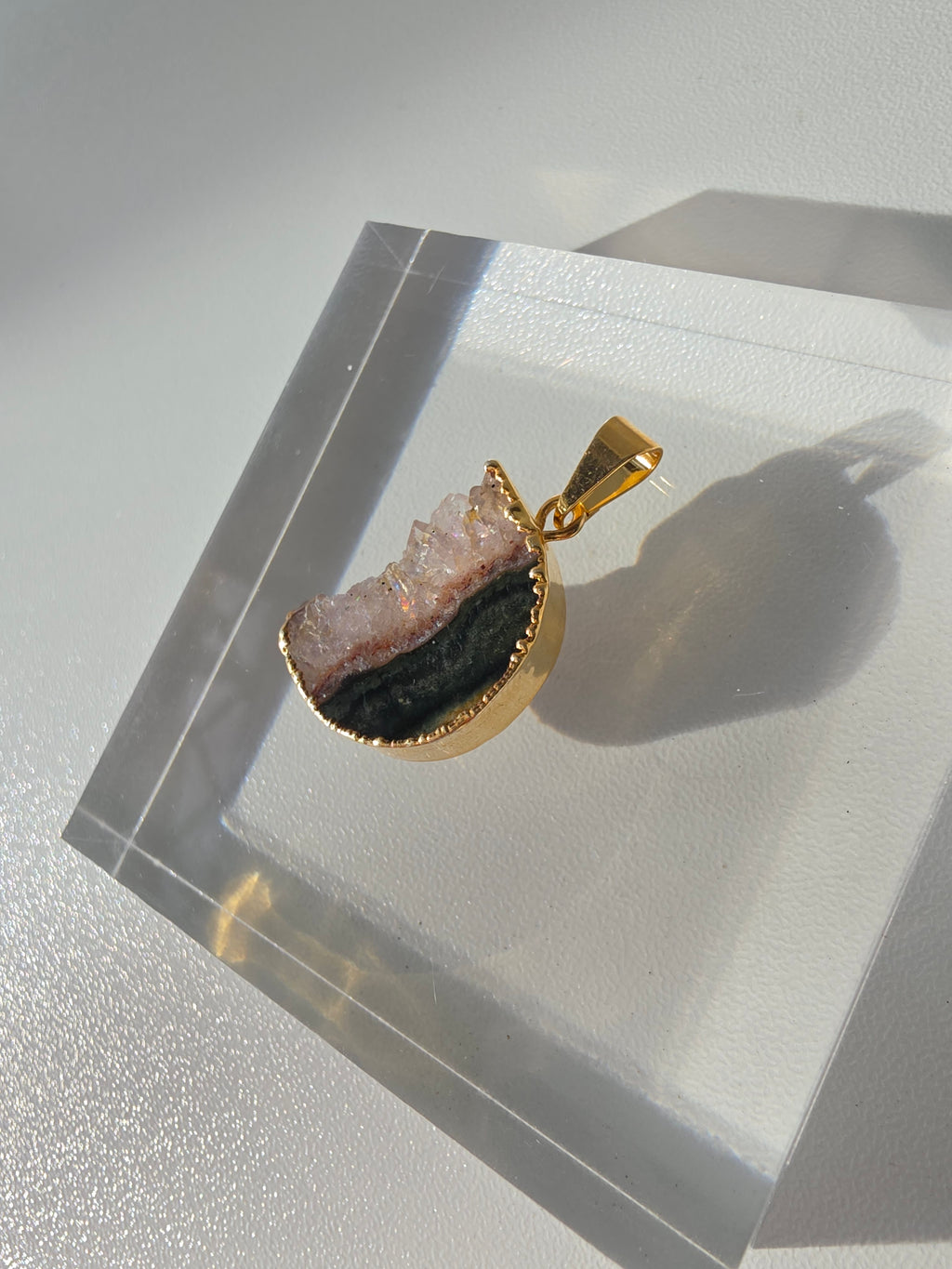 Natural Amethyst Slice Moon Pendant, raw crystal druzy pendant in a gold-plated setting from the Stone & Bloom Raw Luxe Collection.