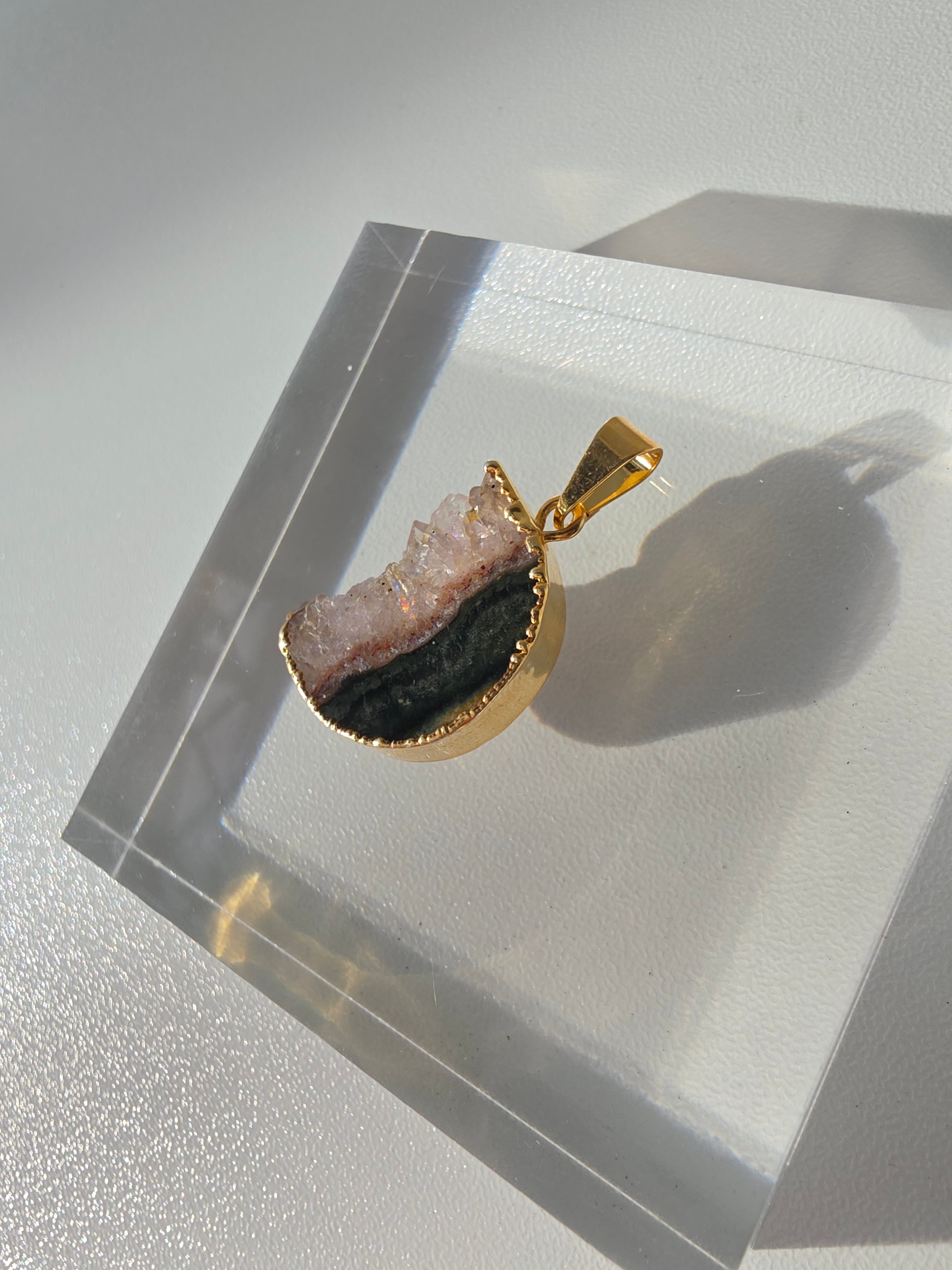 Natural Amethyst Slice Moon Pendant, raw crystal druzy pendant in a gold-plated setting from the Stone & Bloom Raw Luxe Collection.