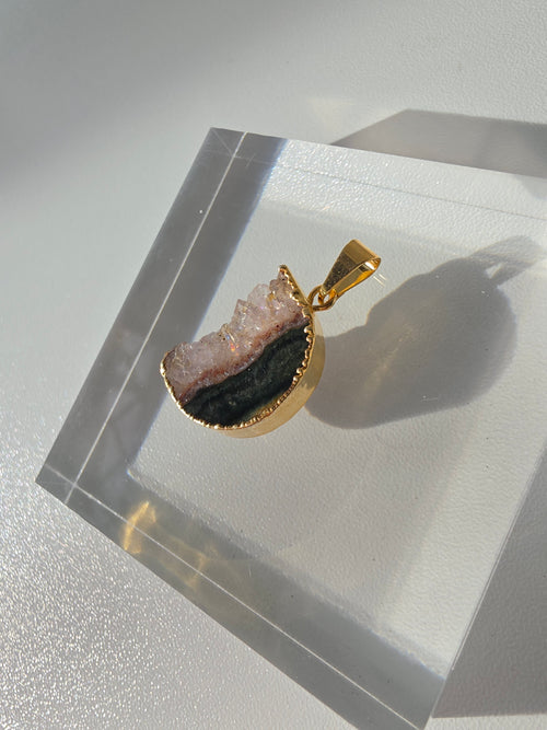 Natural Amethyst Slice Moon Pendant, raw crystal druzy pendant in a gold-plated setting from the Stone & Bloom Raw Luxe Collection.