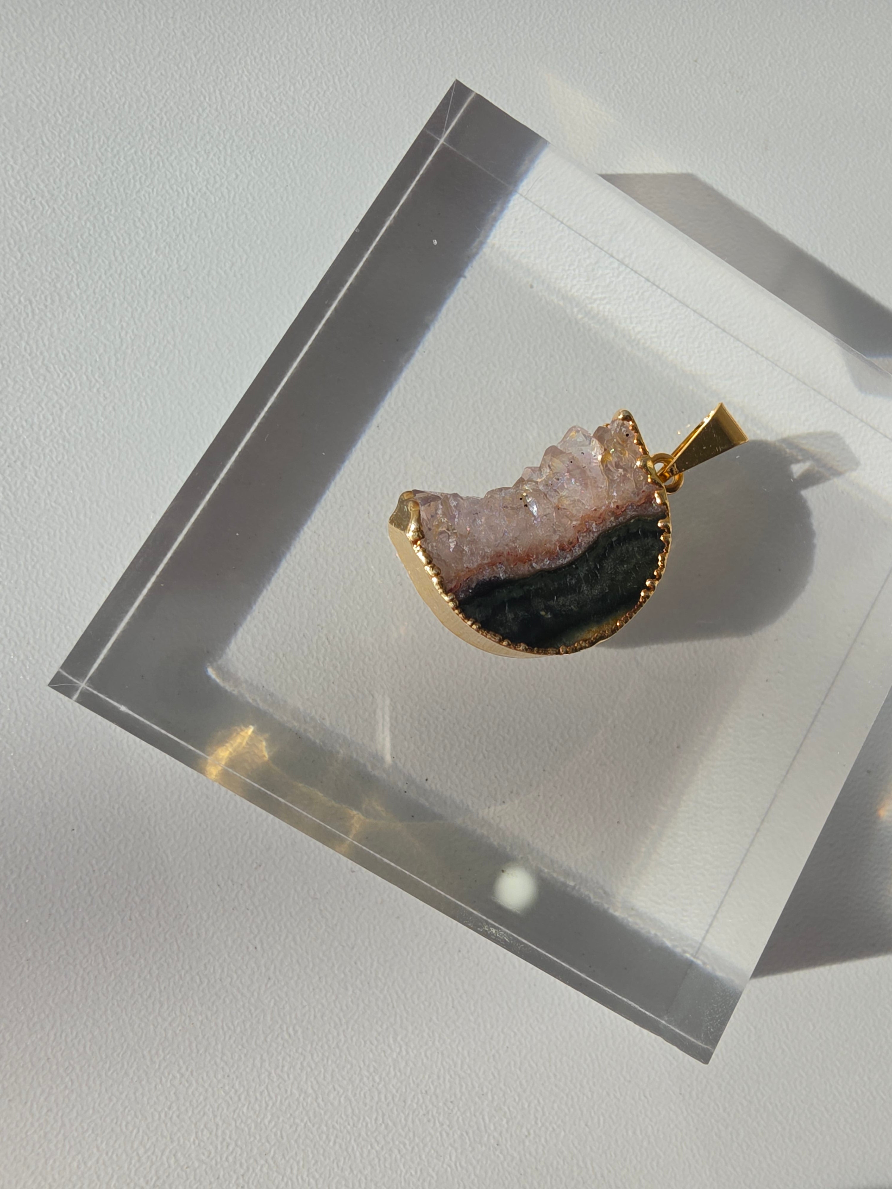Natural Amethyst Slice Moon Pendant, raw crystal druzy pendant in a gold-plated setting from the Stone & Bloom Raw Luxe Collection.