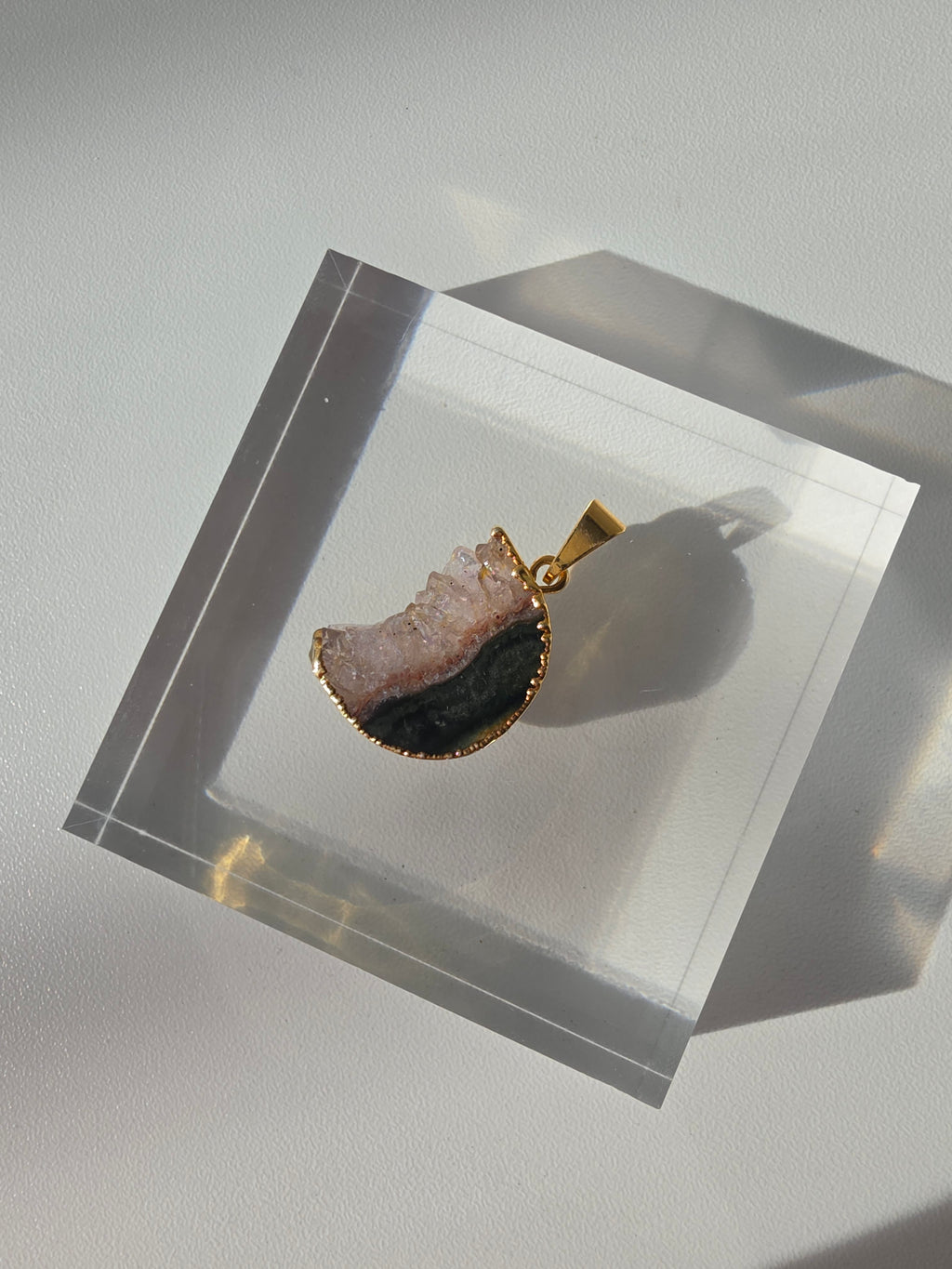 Natural Amethyst Slice Moon Pendant, raw crystal druzy pendant in a gold-plated setting from the Stone & Bloom Raw Luxe Collection.