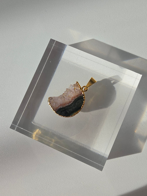 Natural Amethyst Slice Moon Pendant, raw crystal druzy pendant in a gold-plated setting from the Stone & Bloom Raw Luxe Collection.