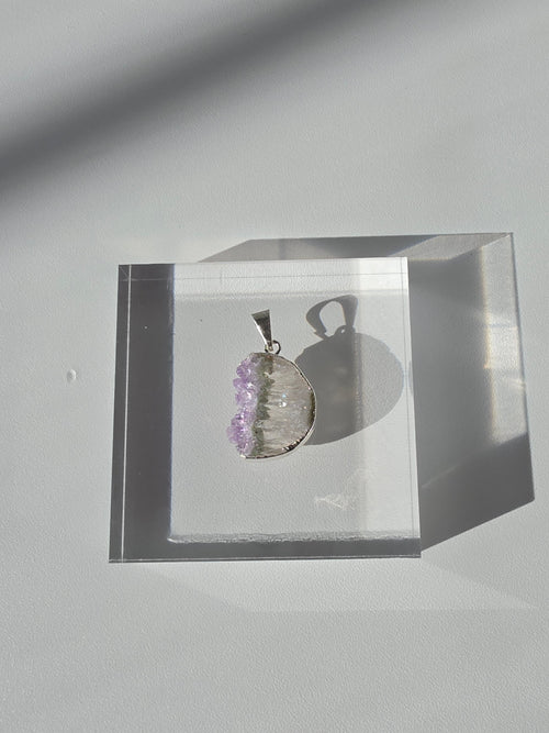 Natural Amethyst Slice Moon Pendant, raw crystal druzy pendant in a silver-plated hypoallergenic setting from the Stone & Bloom Raw Luxe Collection.