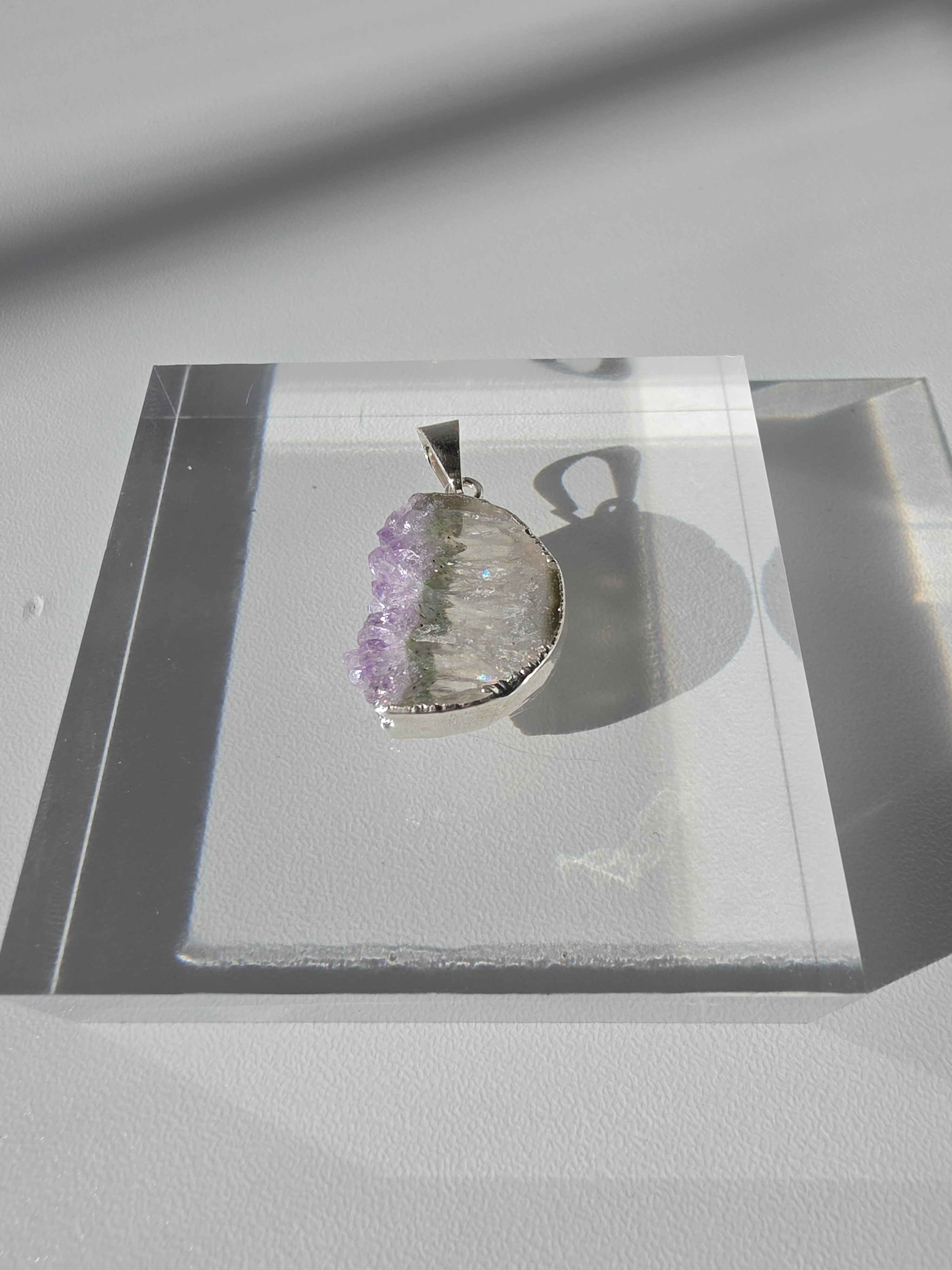 Natural Amethyst Slice Moon Pendant, raw crystal druzy pendant in a silver-plated hypoallergenic setting from the Stone & Bloom Raw Luxe Collection.