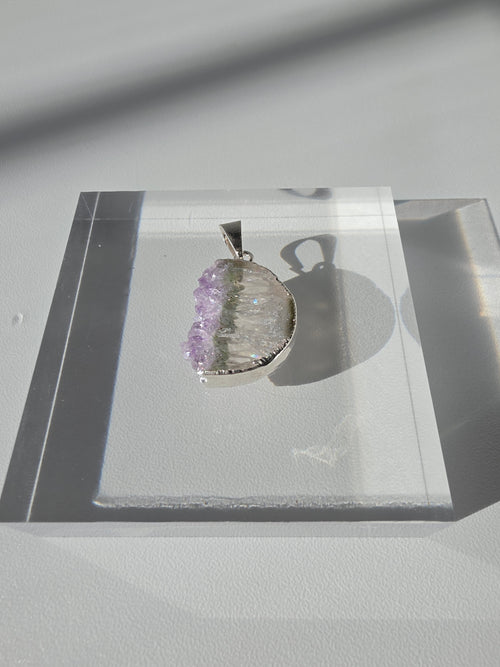 Natural Amethyst Slice Moon Pendant, raw crystal druzy pendant in a silver-plated hypoallergenic setting from the Stone & Bloom Raw Luxe Collection.