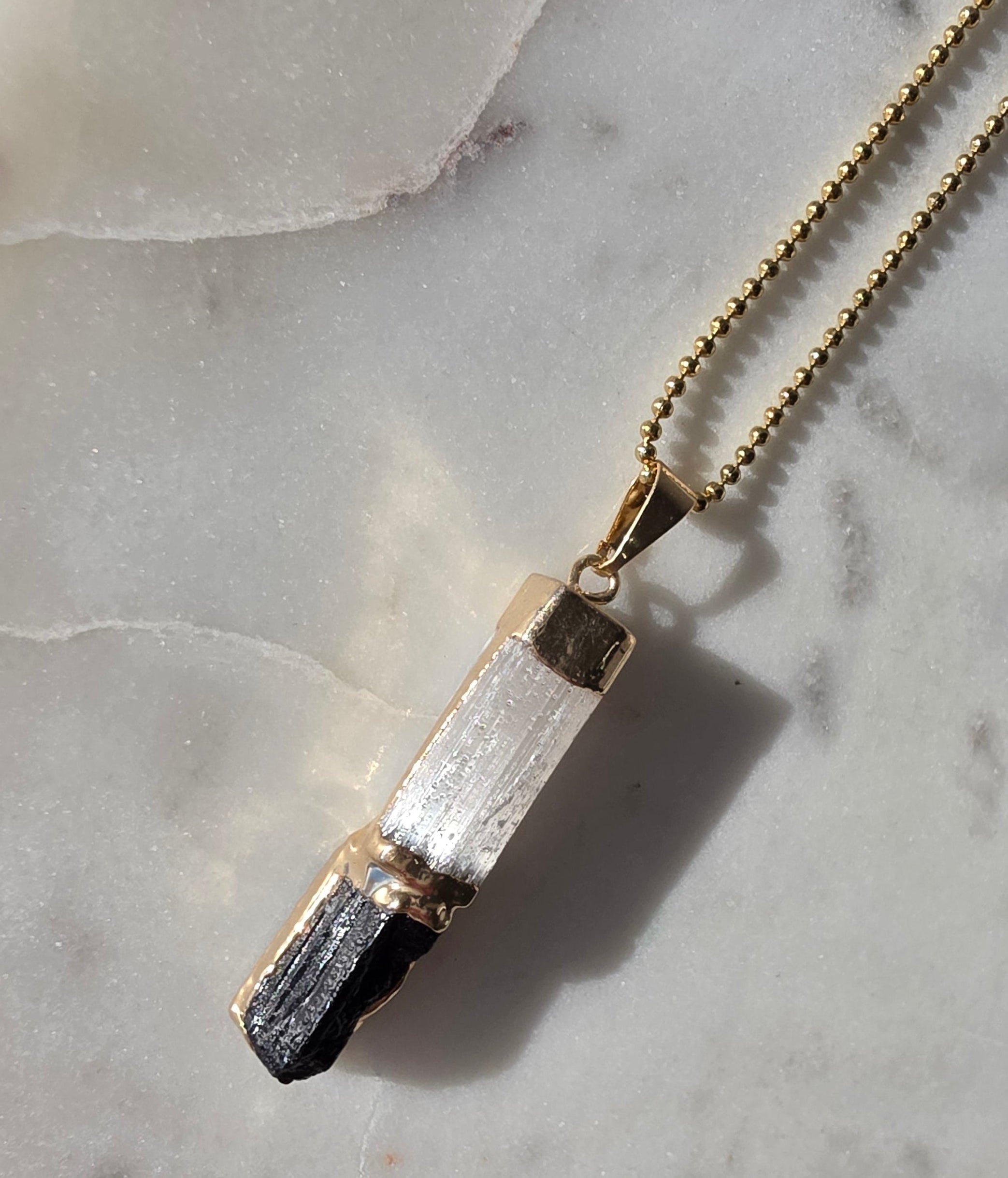 Natural Selenite and Black Tourmaline crystal pendant in a refined 24K Gold Plated setting, Stone & Bloom Raw Luxe Collection