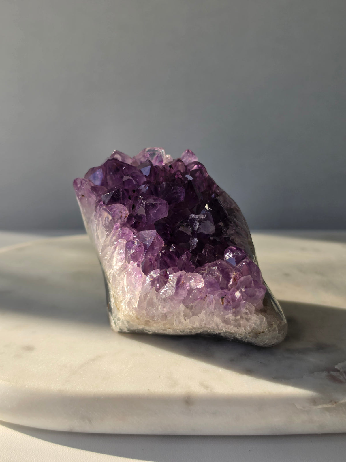 Natural Amethyst freeform cluster with deep purple and lavender crystal formations and dark natural matrix