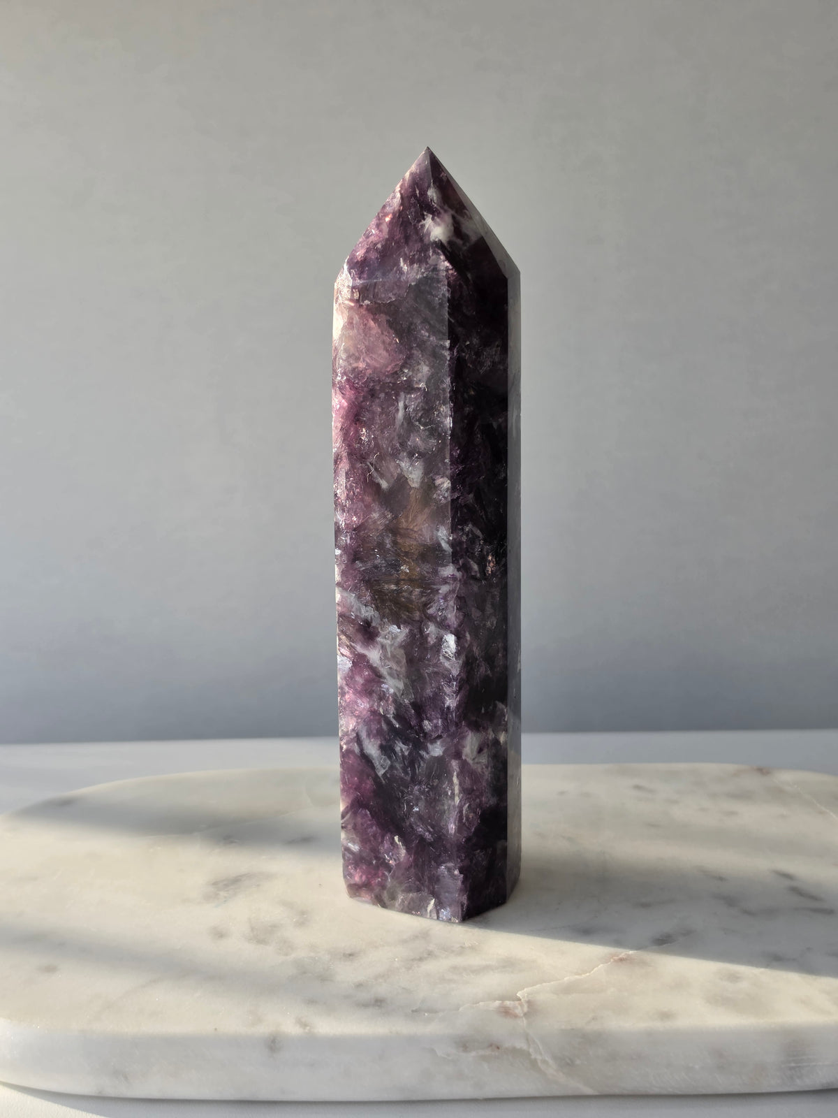 Natural Lepidolite crystal tower with rich purple tones, sparkling mica inclusions and unique lavender mineral formations