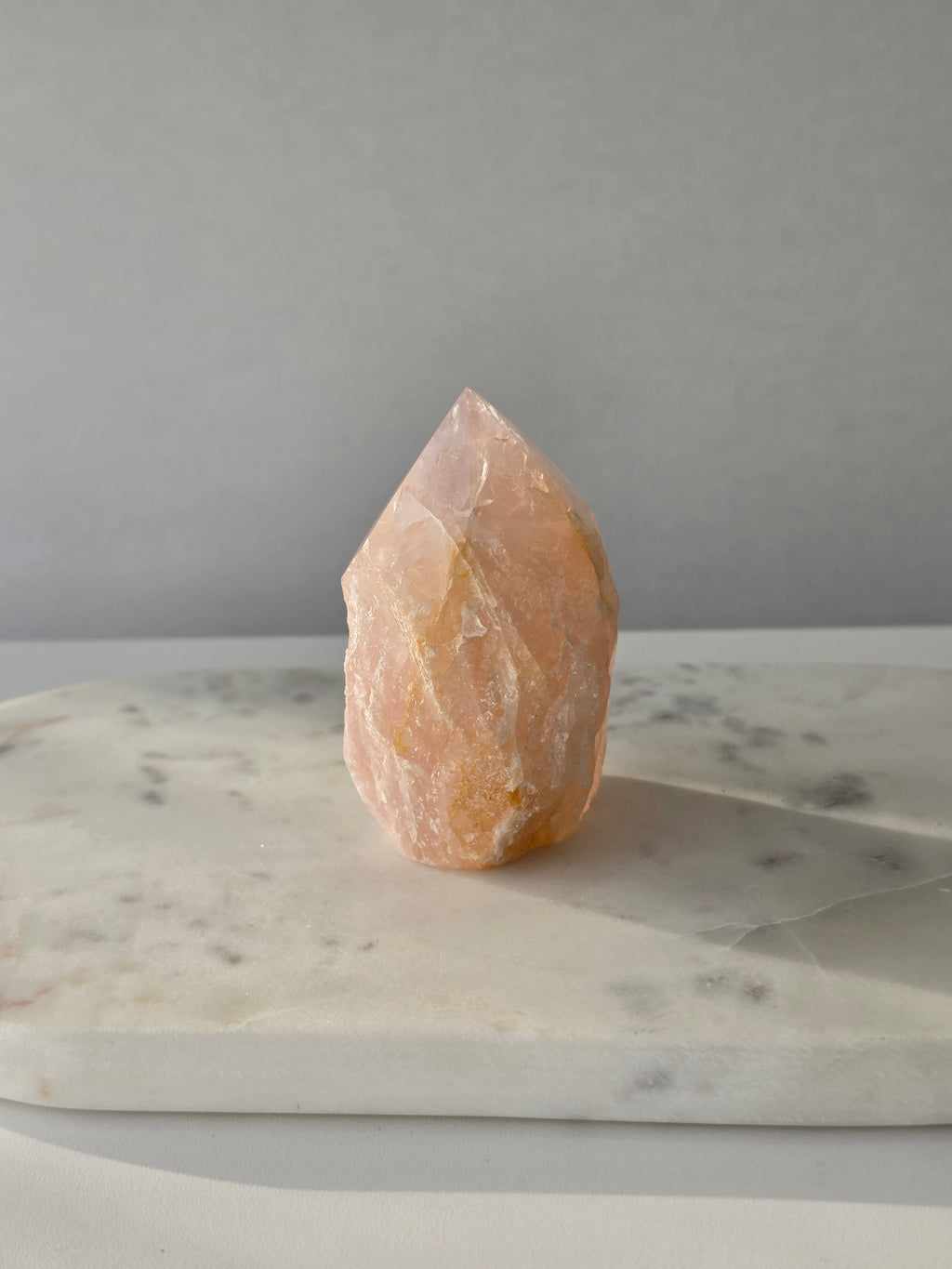 Chunky Rose Quartz and Golden Healer Quartz tower with soft blush pink colouring, warm golden inclusions and a combination of raw crystal texture and polished surfaces