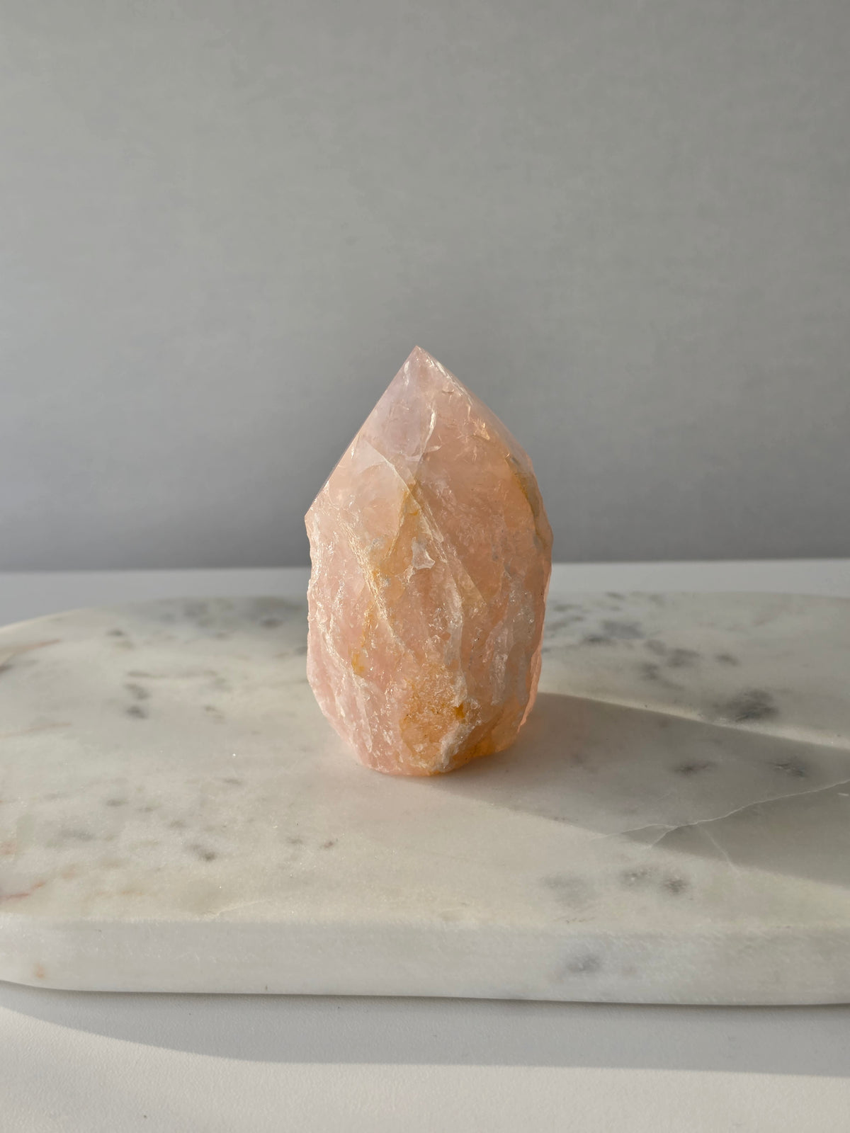 Chunky Rose Quartz and Golden Healer Quartz tower with soft blush pink colouring, warm golden inclusions and a combination of raw crystal texture and polished surfaces